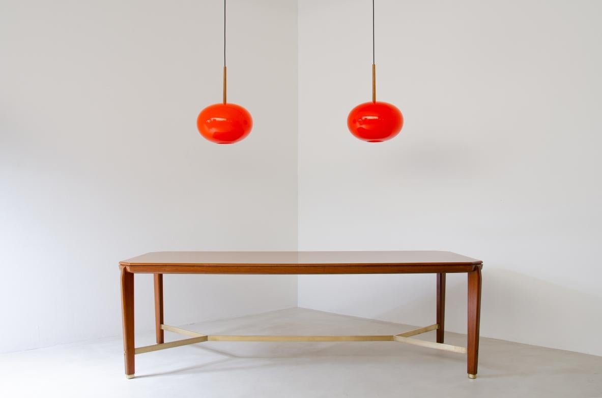 Pair of pendant chandeliers with wooden stem and red blown glass diffuser. In Excellent Condition For Sale In Milano, IT