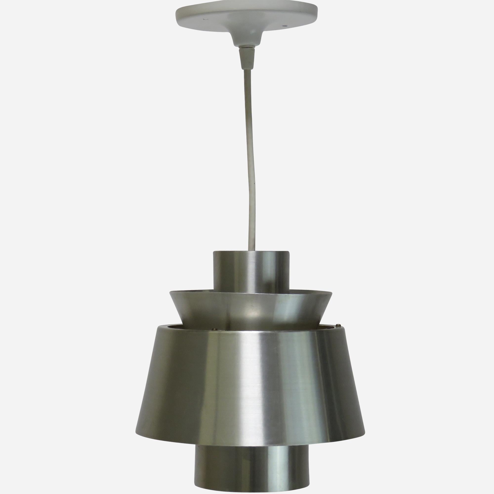 A spun aluminum pendant lamp. Designed in 1947 for the Tivoli amusement park in Copenhagen and became known by the same name. Decades later Nordisk Solar lost the rights to call it 'Tivoli' and it was then re-named 