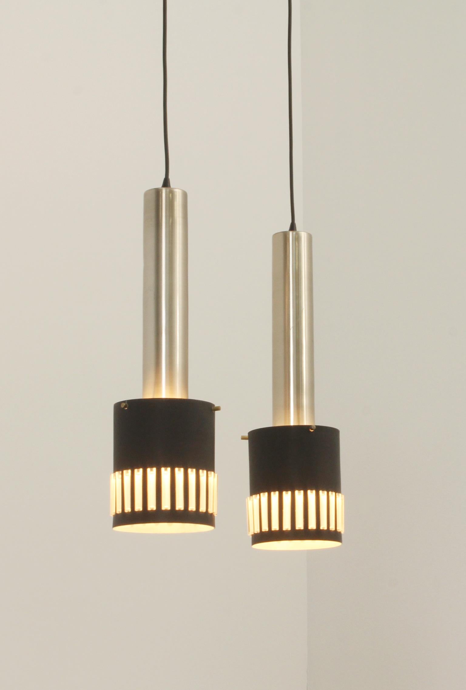 Pair of pendant lamps from 1960's, Spain. Aluminum, brass and lacquered metal with transparent acrylic inlays.