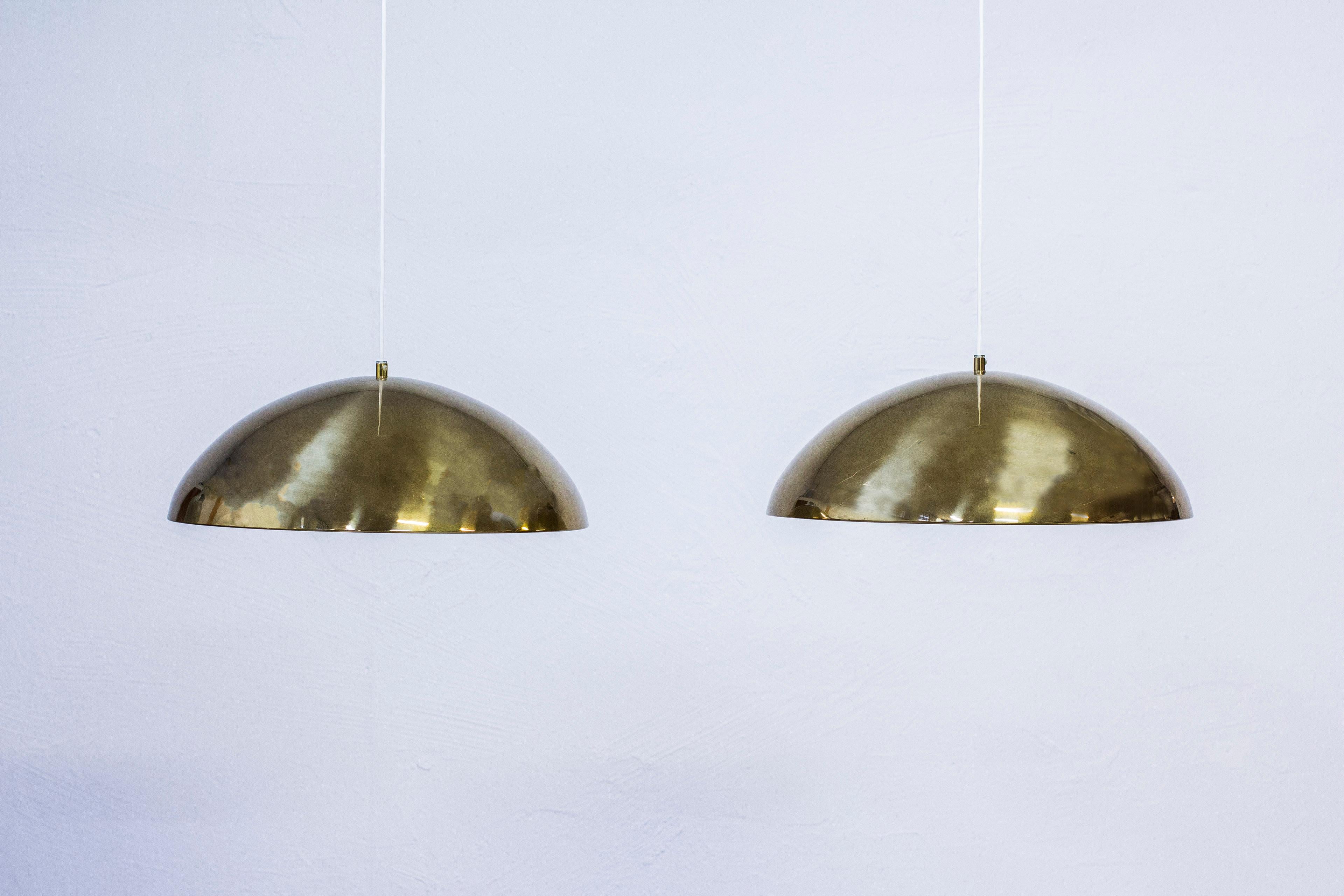 Ceiling lamps produced in Sweden by Bergboms. Made during the 1960s. Manufactured from solid brass with opalin glass shades on the inside. Very good vintage condition with signs of wear and patina.

Pair available.

  