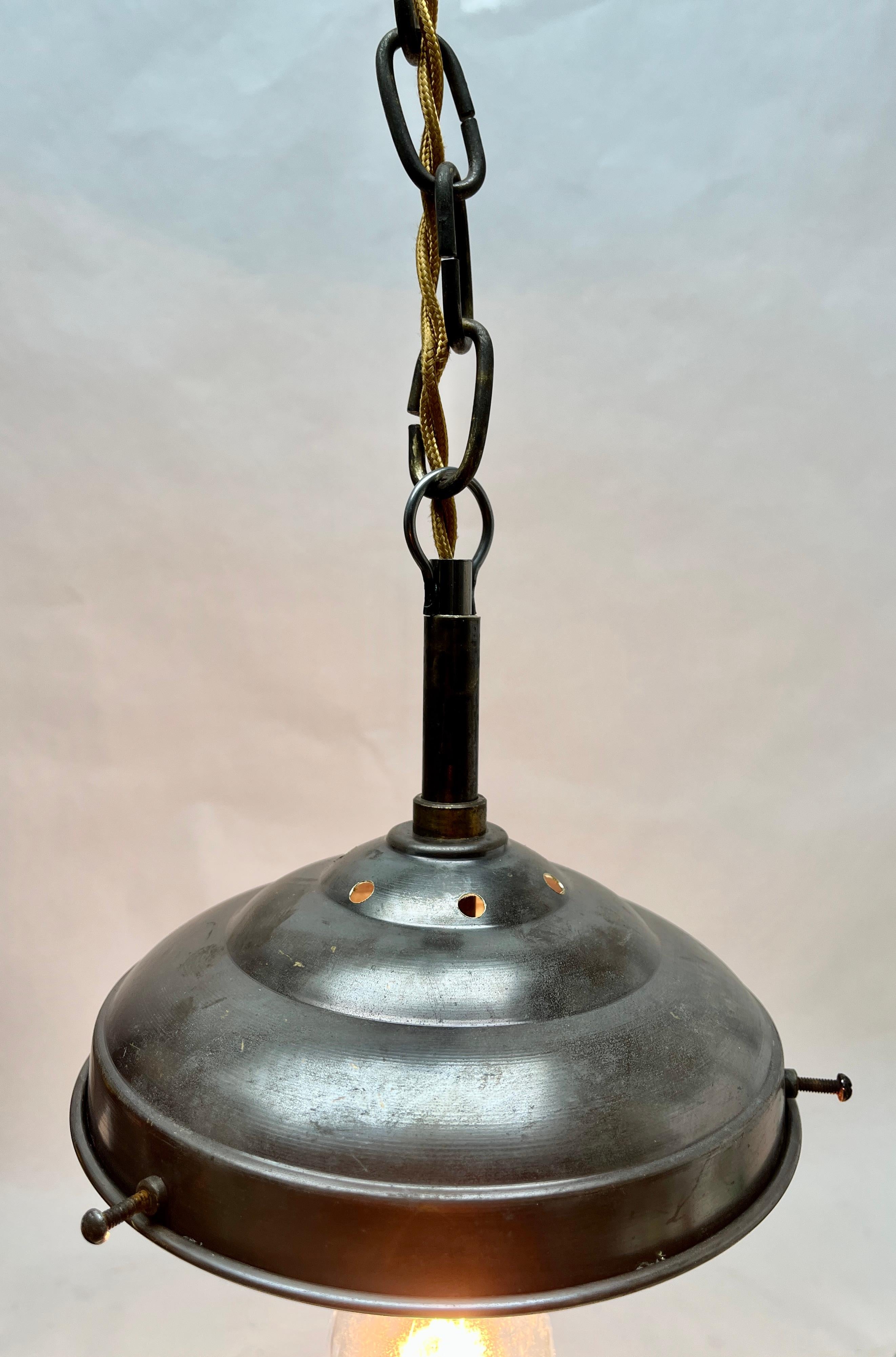 From the range by the Phillips Company, this centre-light is on a central chain. The lamp has a fitting on a Solid Brass plate and holds a globular shade of opaline glass.

In good condition and in full working order with standard New lamp