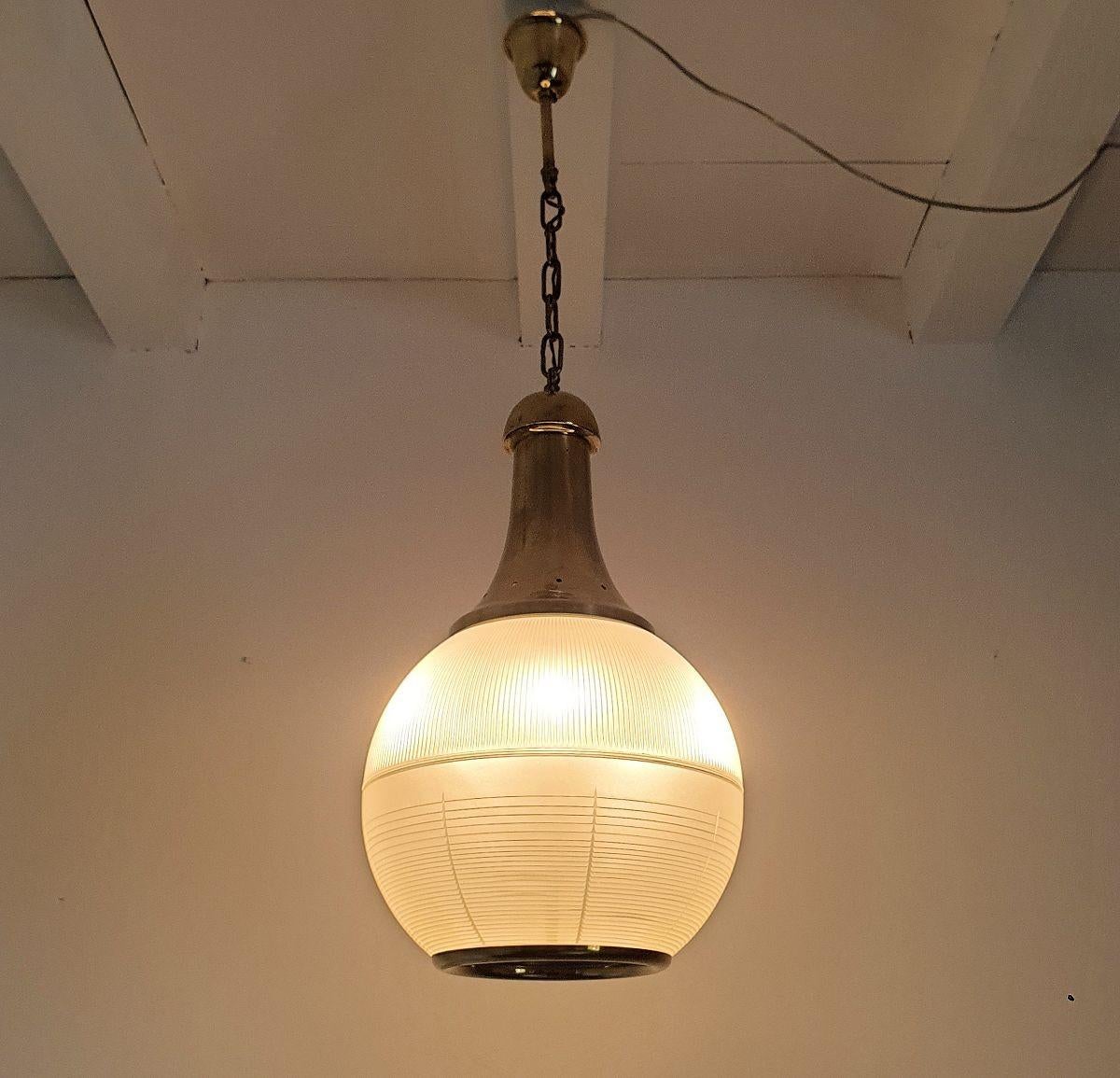 Brass Pair of pendant lights by Dominioni For Sale