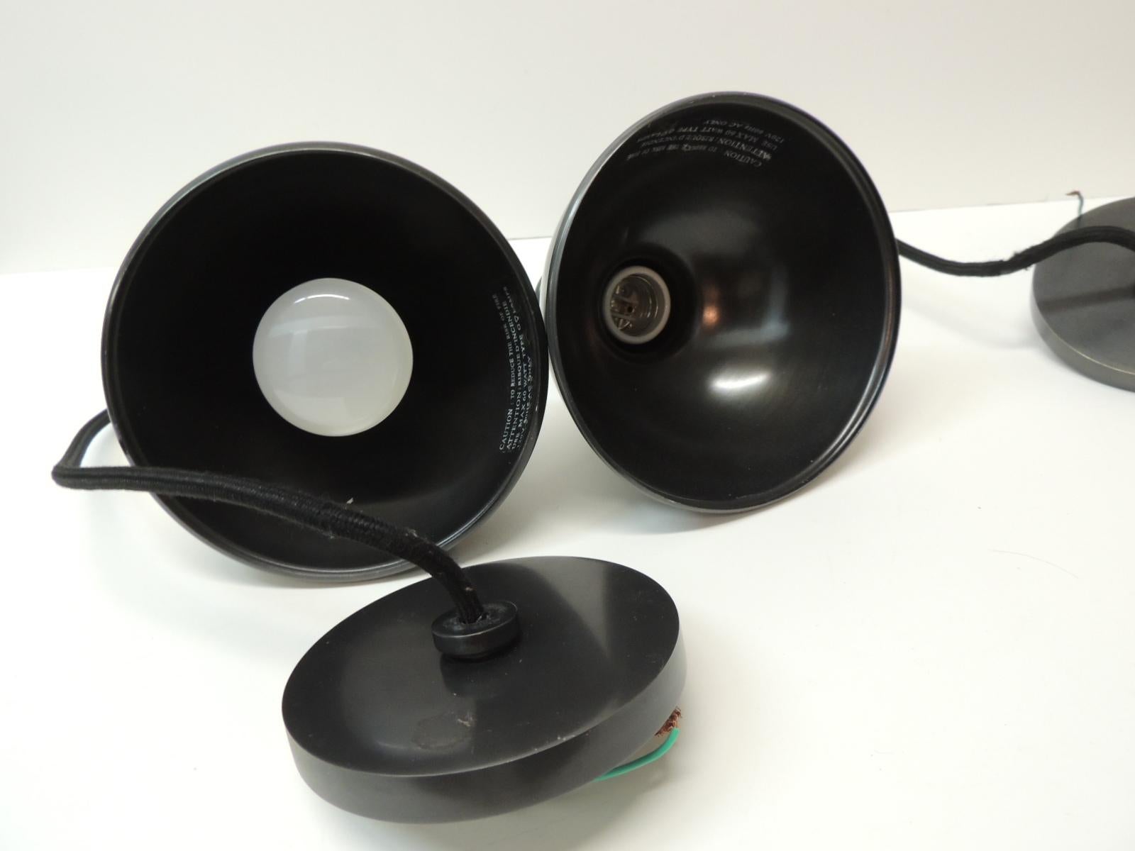 Pair Of Pendant Lights In Gunmetal Color With A Cloth Covered Cord