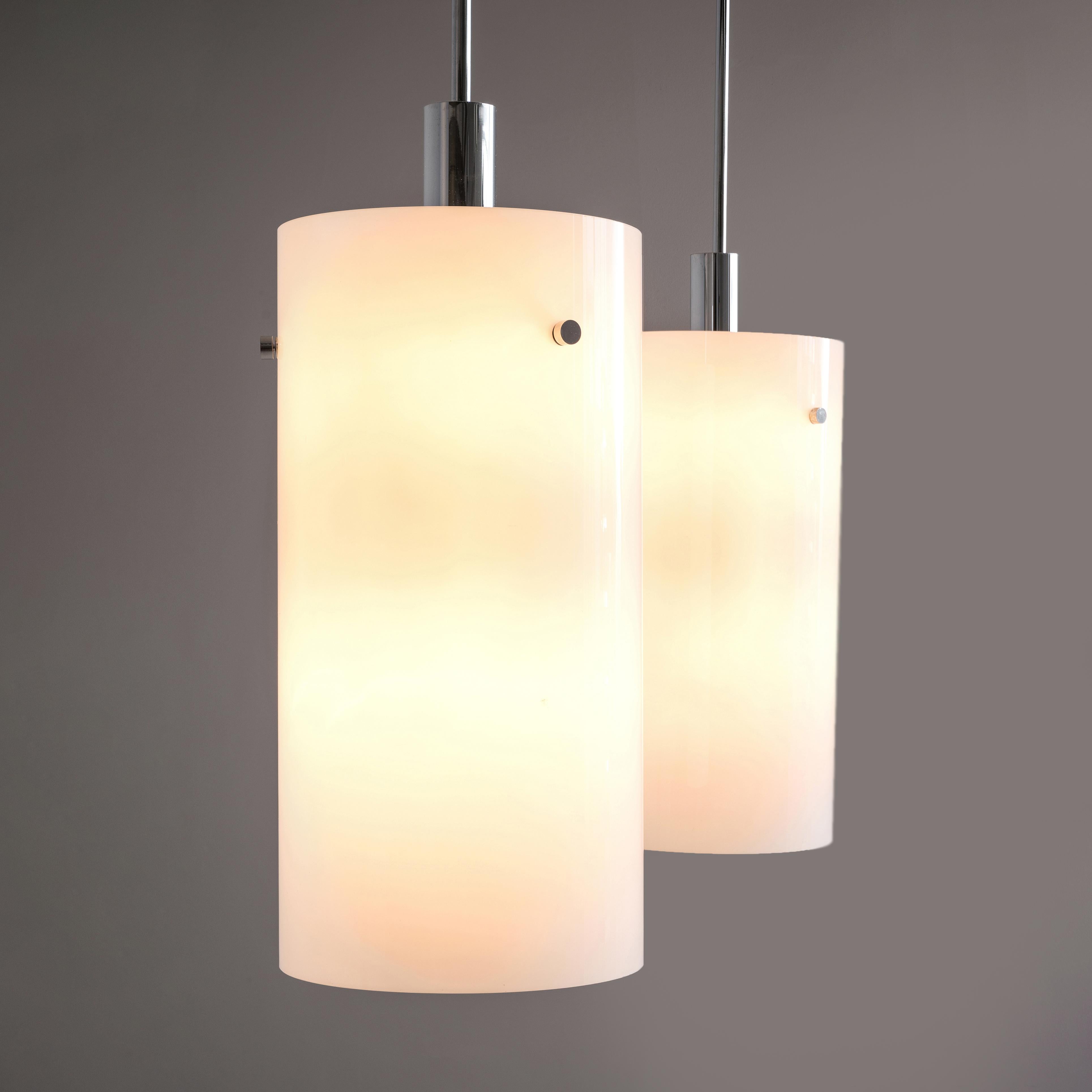 Pendants, metal, glass, Europe, 1970s

This set of atmospheric pendants are cylindrically shaped and executed in white glass, which results in a nice soft light-tone creating a lively ambience in the room. The fixture is based on a minimalist design