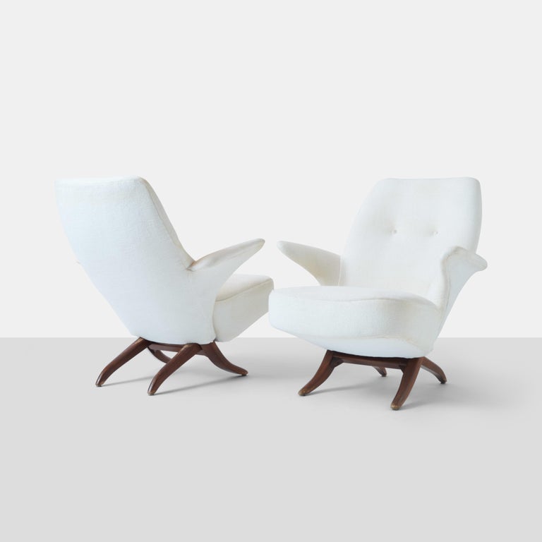 A pair of Penguin lounge chairs by Theo Ruth for Artifort. The chair is based on an African chair design and the successor to his own Congo chair. The seat and back can separate by way of a modular design comprised of two interlocking pieces and