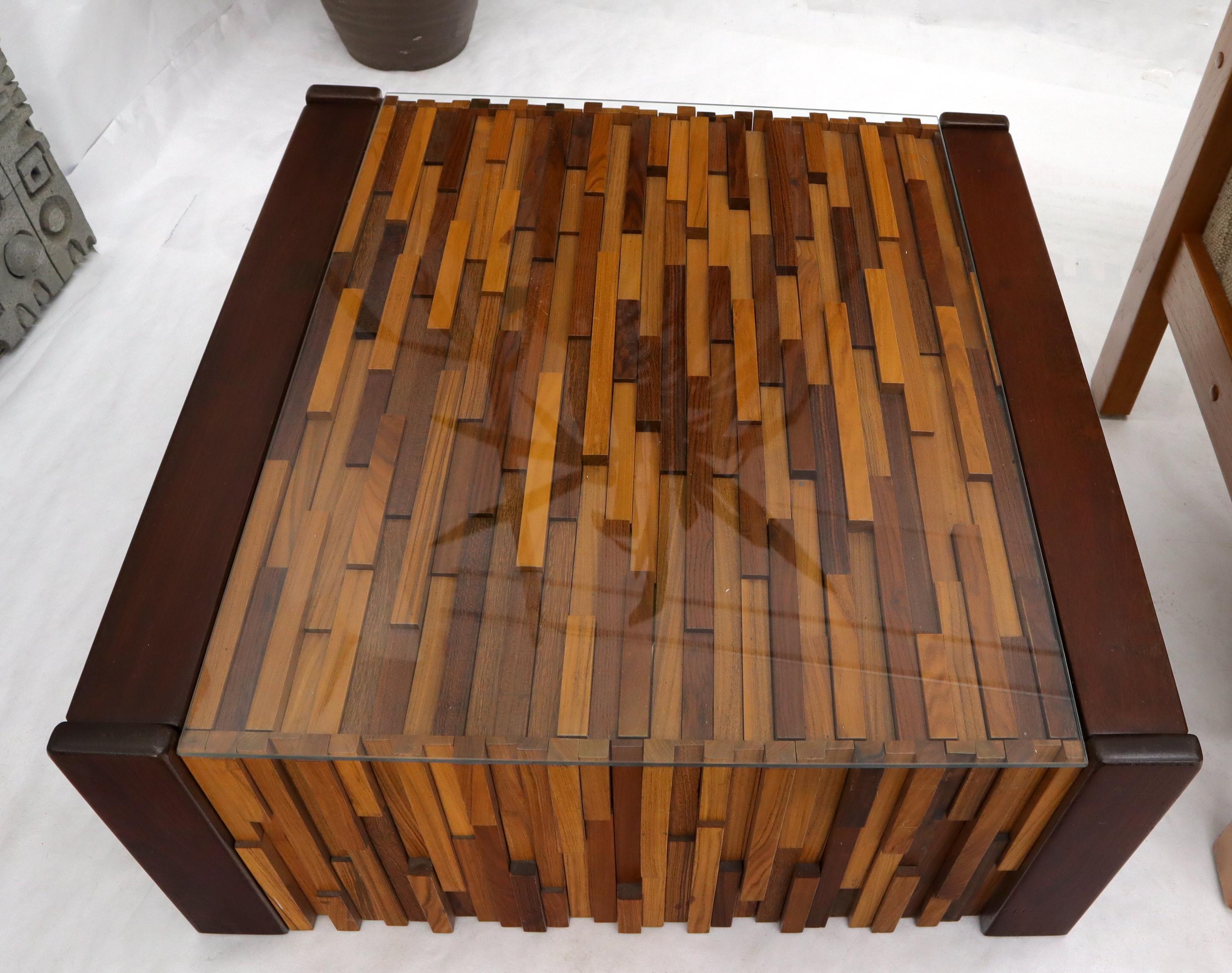 Pair of Percival Lafer coffee tables with glass tops over rosewood hardwood mosaic. 
 