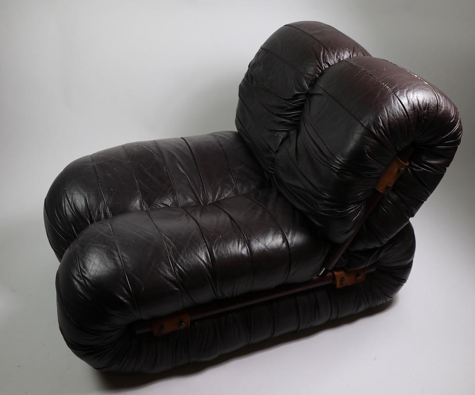 Rare pair of leather lounge chairs designed by Percival Lafer. Leather skin upholstery with exposed rosewood frames. Sophisticated low slung design, stylish, and comfortable chairs in very good original vintage condition. Priced and offered as a