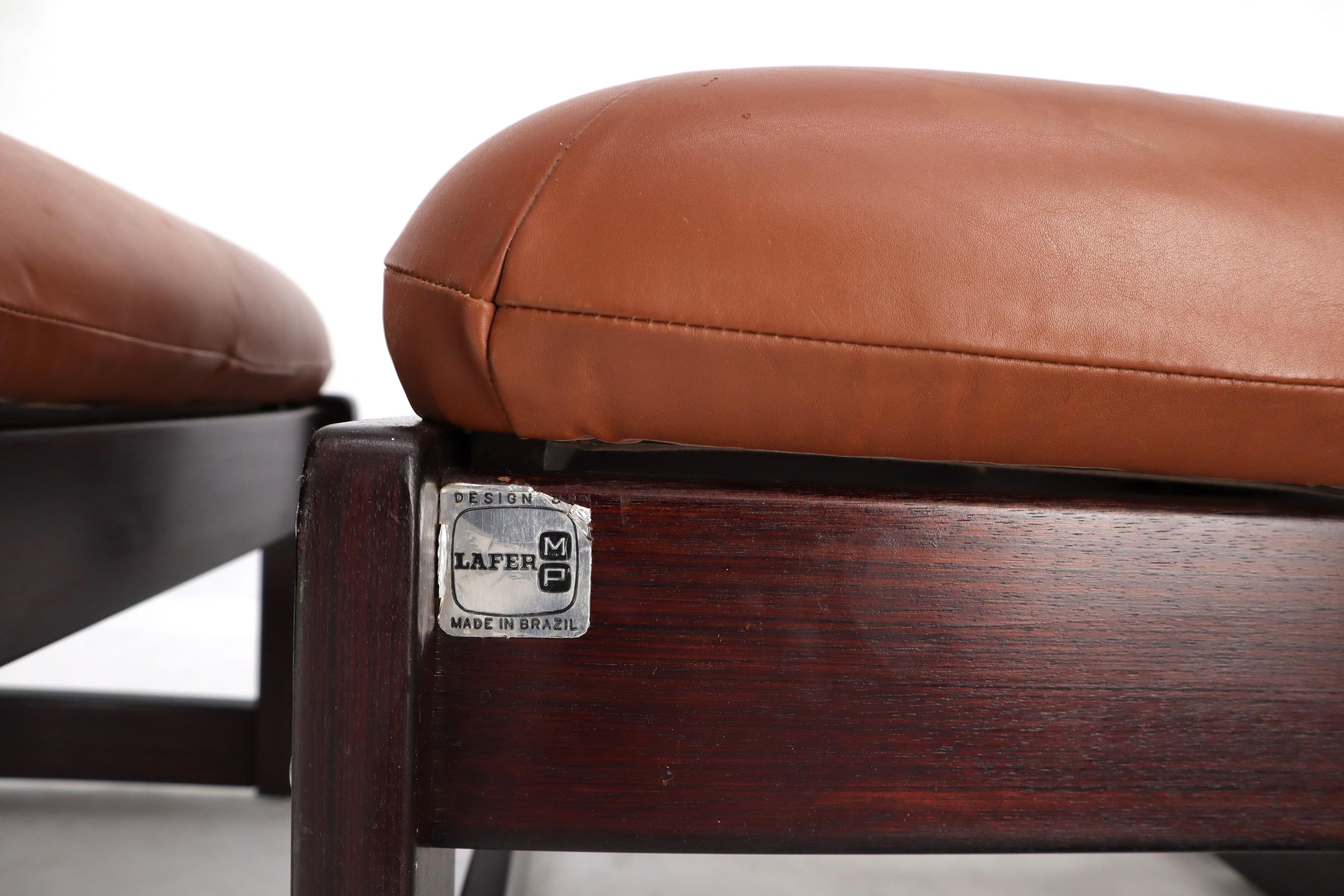 Pair of Mid-Century Modern Brazilian rosewood tan leather upholstery foot stools benches.