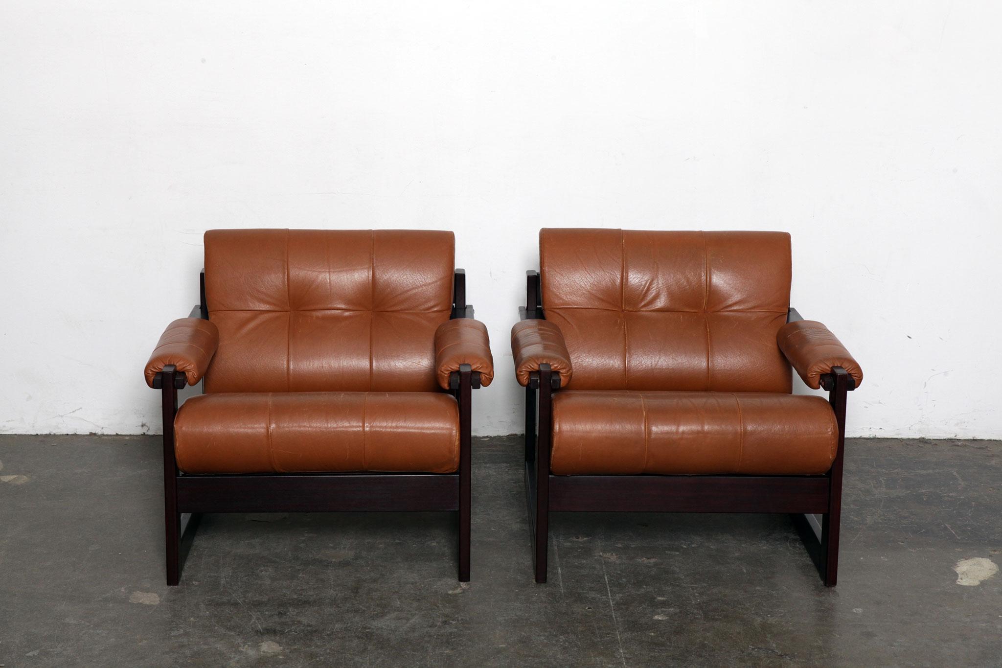 Pair of vintage Brazilian lounge chairs by Percival Lafer in original burnt orange leather with jatoba wood frames, model MP-167. Brazil, 1970s, in very nice original condition. All straps and leather are in good condition.