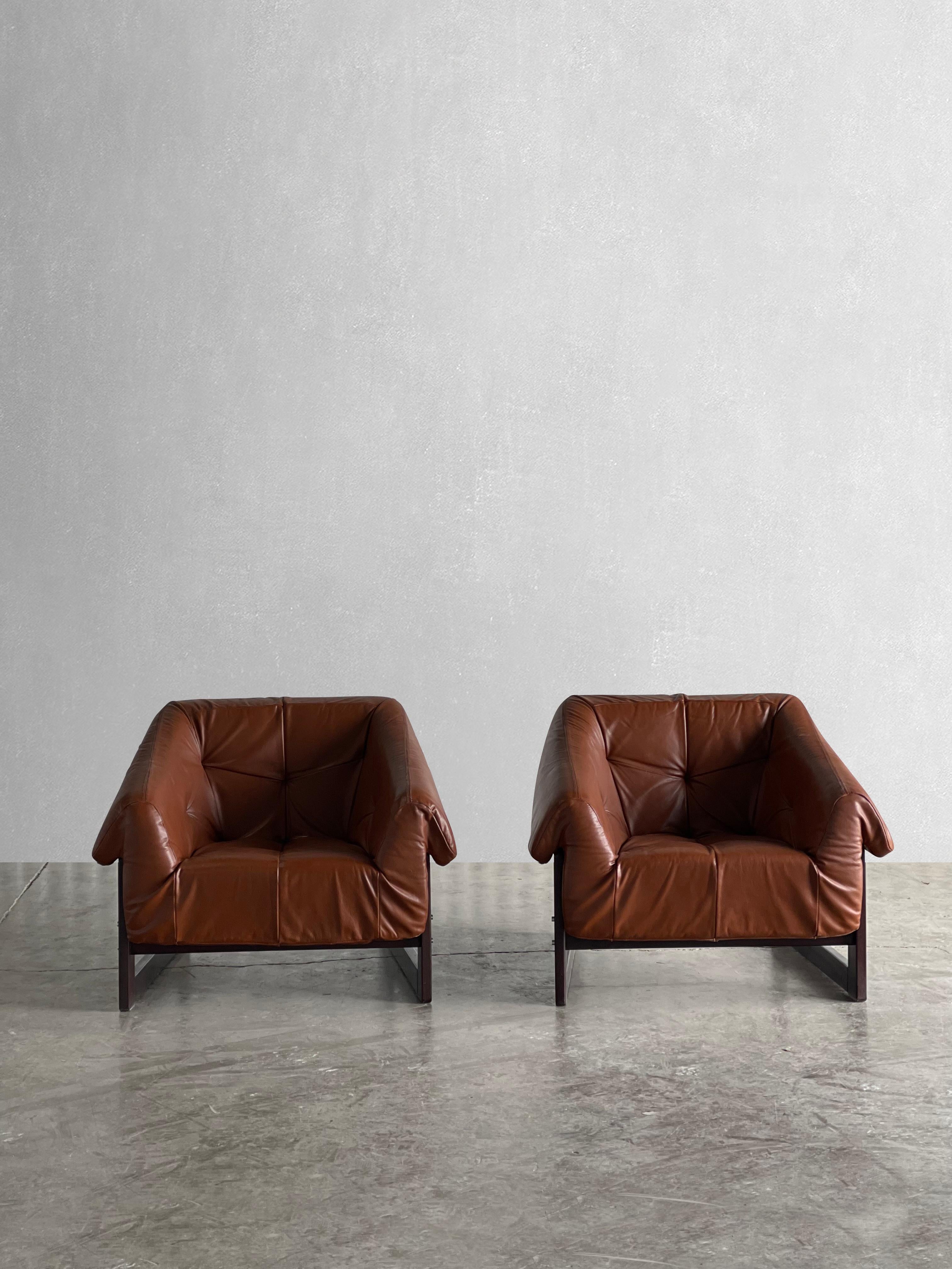 circa 1970s

Percival Lafer was one of the most prolific designers of the Brazilian midcentury period.

The tufted cognac leather cushion sits on sturdy leather straps, which are attached to the jacaranda rosewood frame with dowels.

The seat