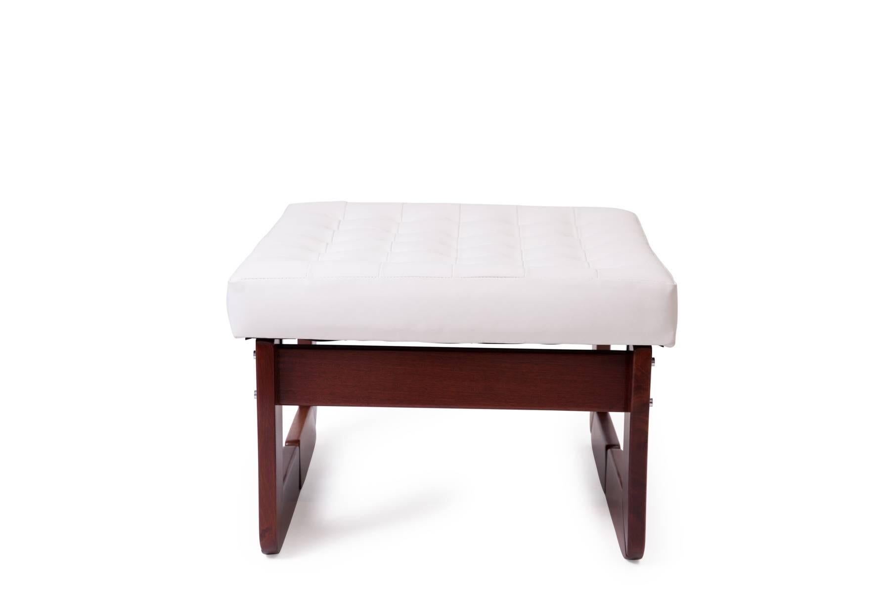 Pair of white tufted leather Percival Lafer solid rosewood and upholstered ottomans, circa early 1970s. These examples have been newly upholstered Price listed is for the pair.