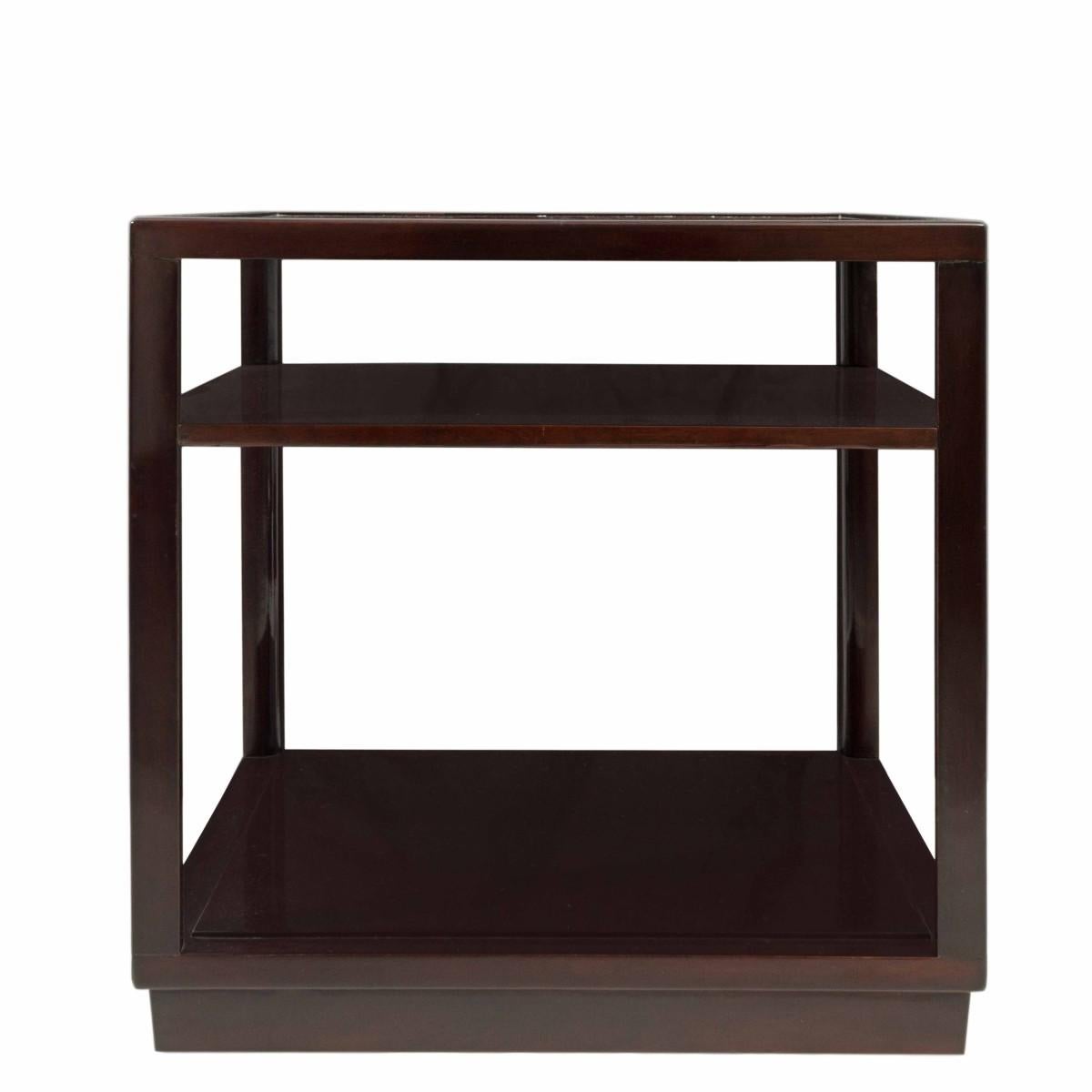 Pair of cube-shaped, three-level end tables by Edward Wormley for Dunbar, signed, USA, circa 1950.

Professionally refinished in dark chocolate brown. Very good to excellent condition.

Dimensions:
23 inches L
23 inces W
23 inches H.
