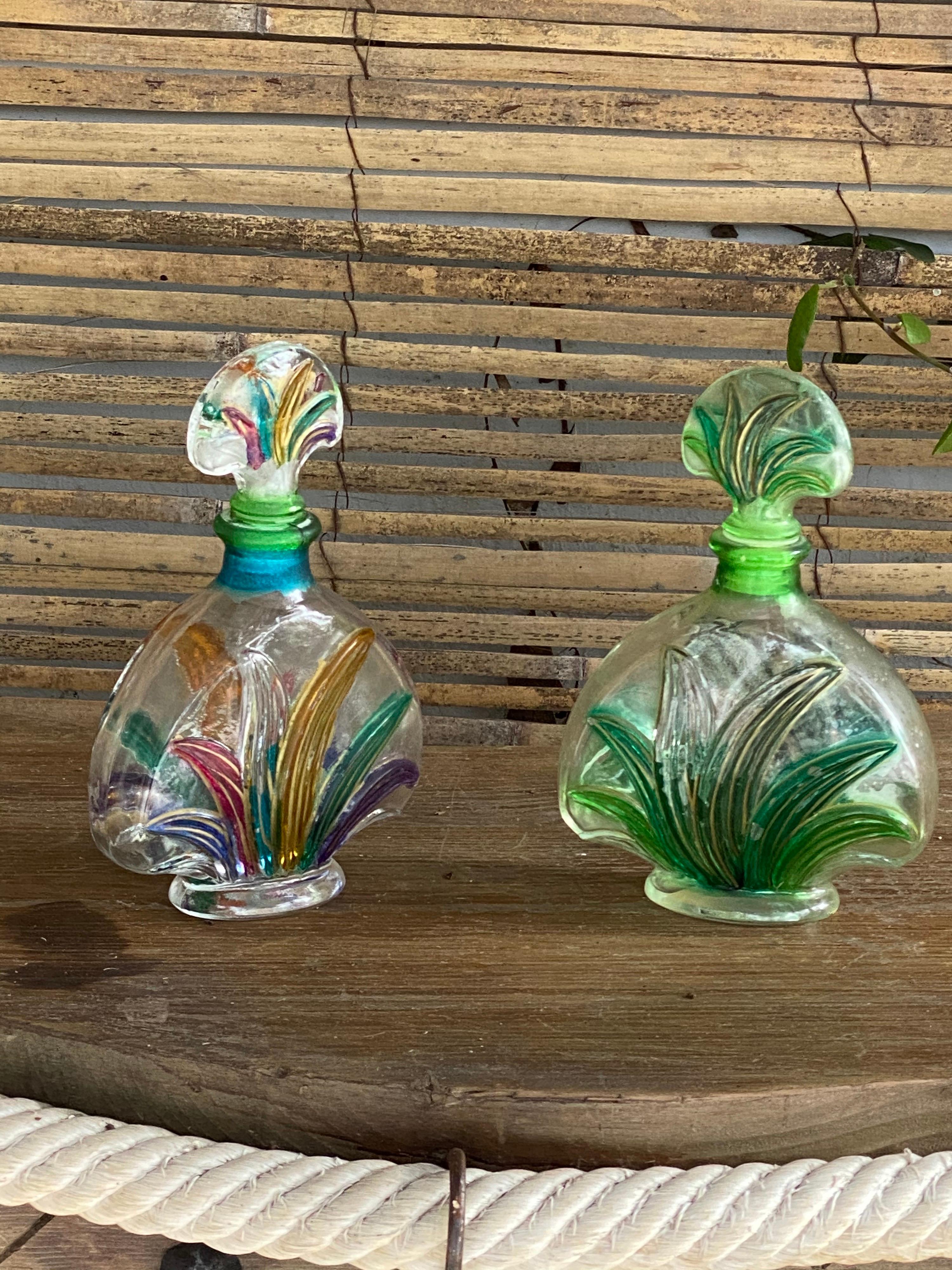 This pair of glass perfume bottle, has been made in France in the 1970s.