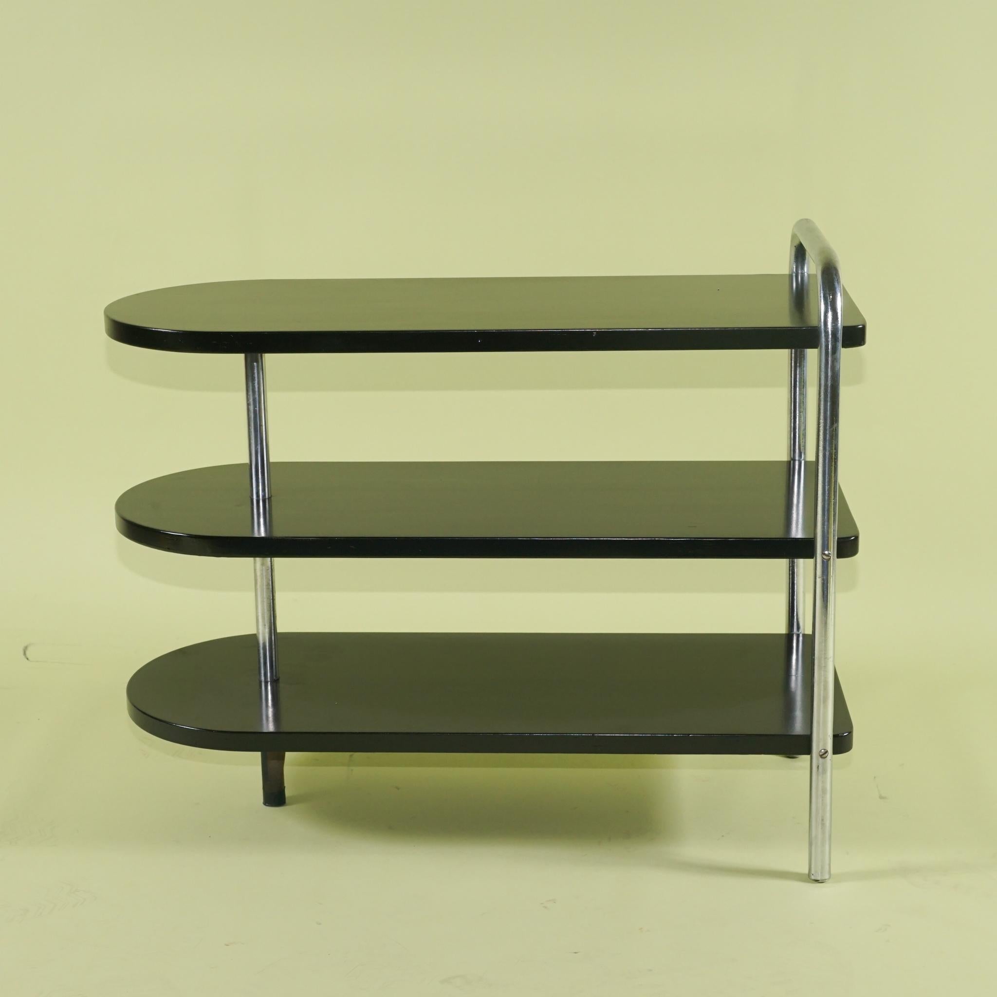 This pair of modernist low tables designed by Wolfgang Hoffmann for Howell were made circa 1938 and are in excellent almost original condition. The chrome is completely original and has almost no pitting or discoloration. The lacquer appears to be