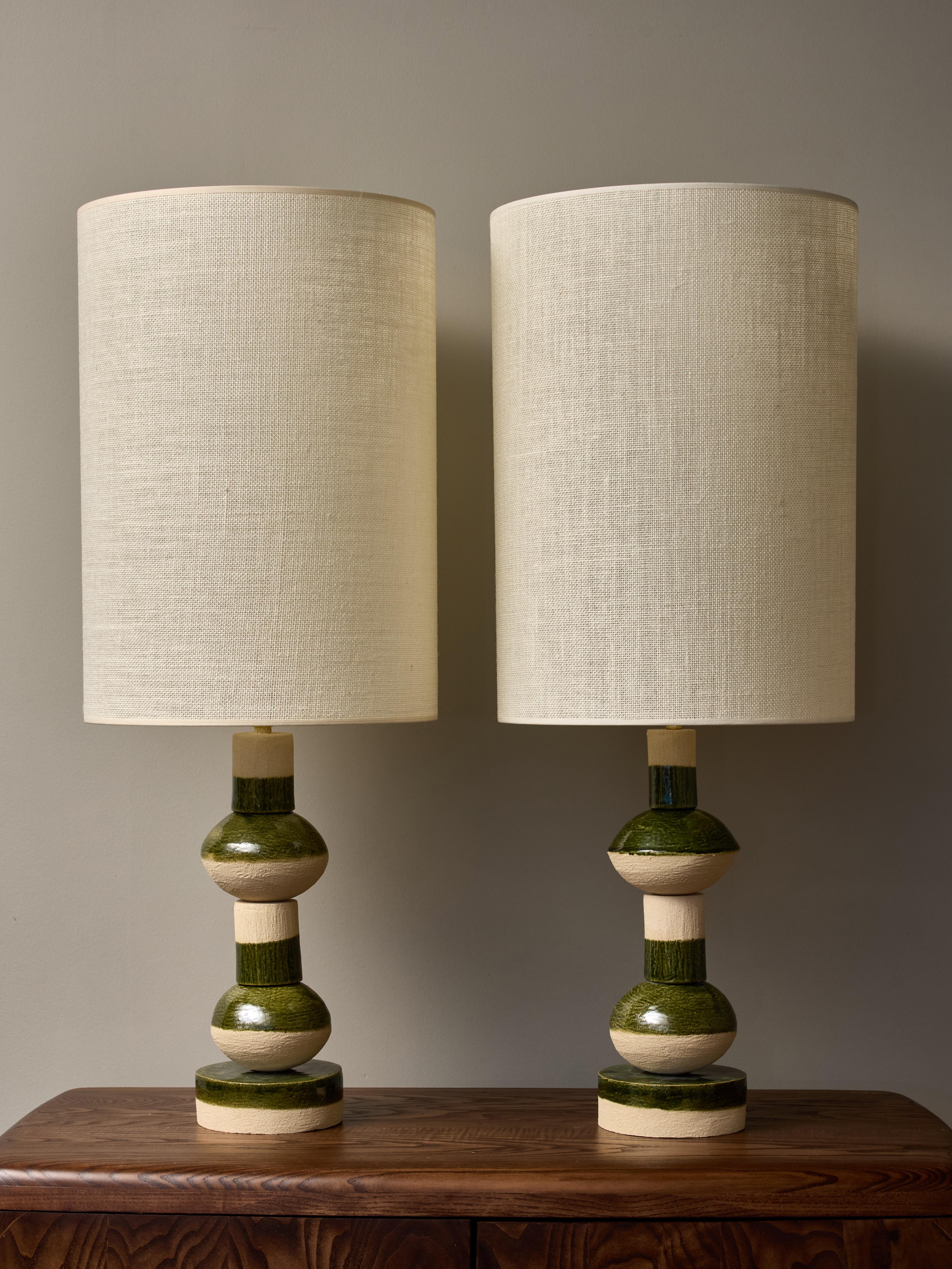 Inspired by the same shapes utilized for the Perlo suspensions,
The Marseille native and based ceramist Amandine Gorrino created these Perlito table lamps by stacking artisanally made ceramic pieces with a deep green glaze.
Today as an artisan,