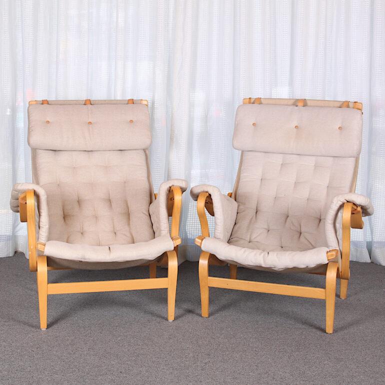 Beautiful pair of Pernilla armchairs The classic and comfortable Pernilla 69 has a beech frame with supporting web. Cushions stuffed with polyether and fiberfill.