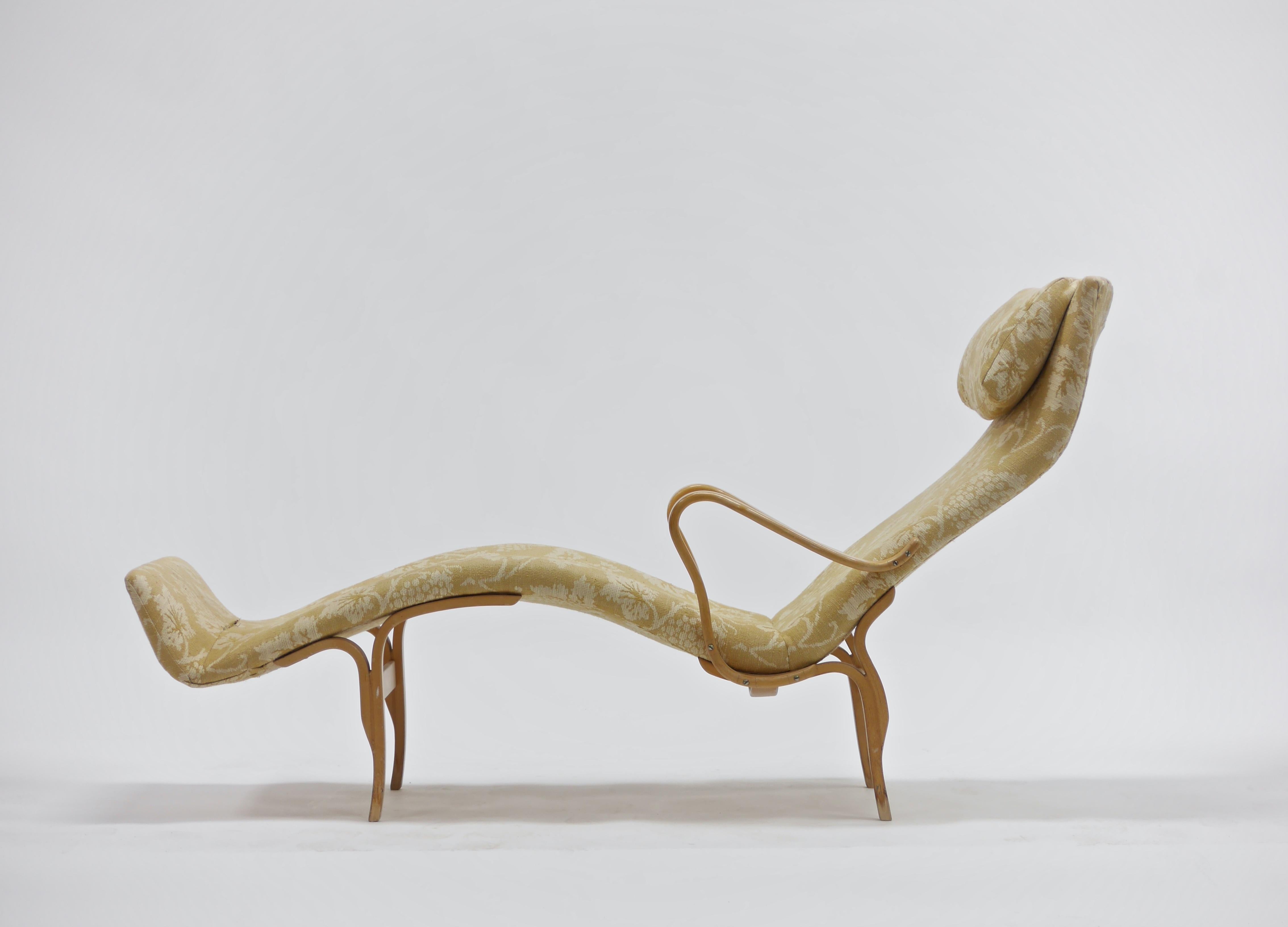 Pair of Pernilla chaise lounges by Bruno Mathsson. Unusual upholstered version with arms. Original vintage condition.