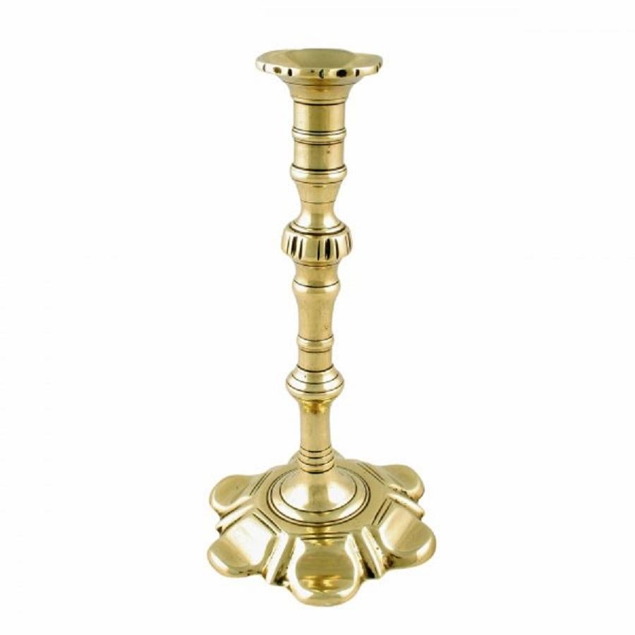 A pair of Victorian brass 18th century style petal base candlesticks.

These candlesticks are copies of Georgian candlesticks and are in very good condition. (Circa 1860)

Measures: Height 21.5cm (8.5 inches)
Diameter 11.5cm (4.5 inches).