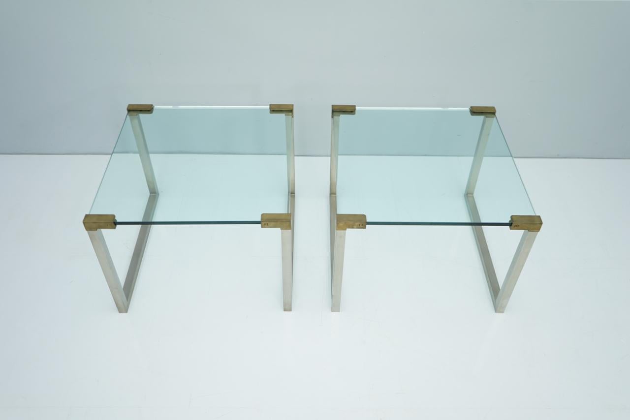 Pair of T53 side tables by Peter Ghyczy, circa 1970s.
Brushed metal, brass and glass.
Size: W 61 cm, D 61 cm, H 46 cm.
Very good condition.
     