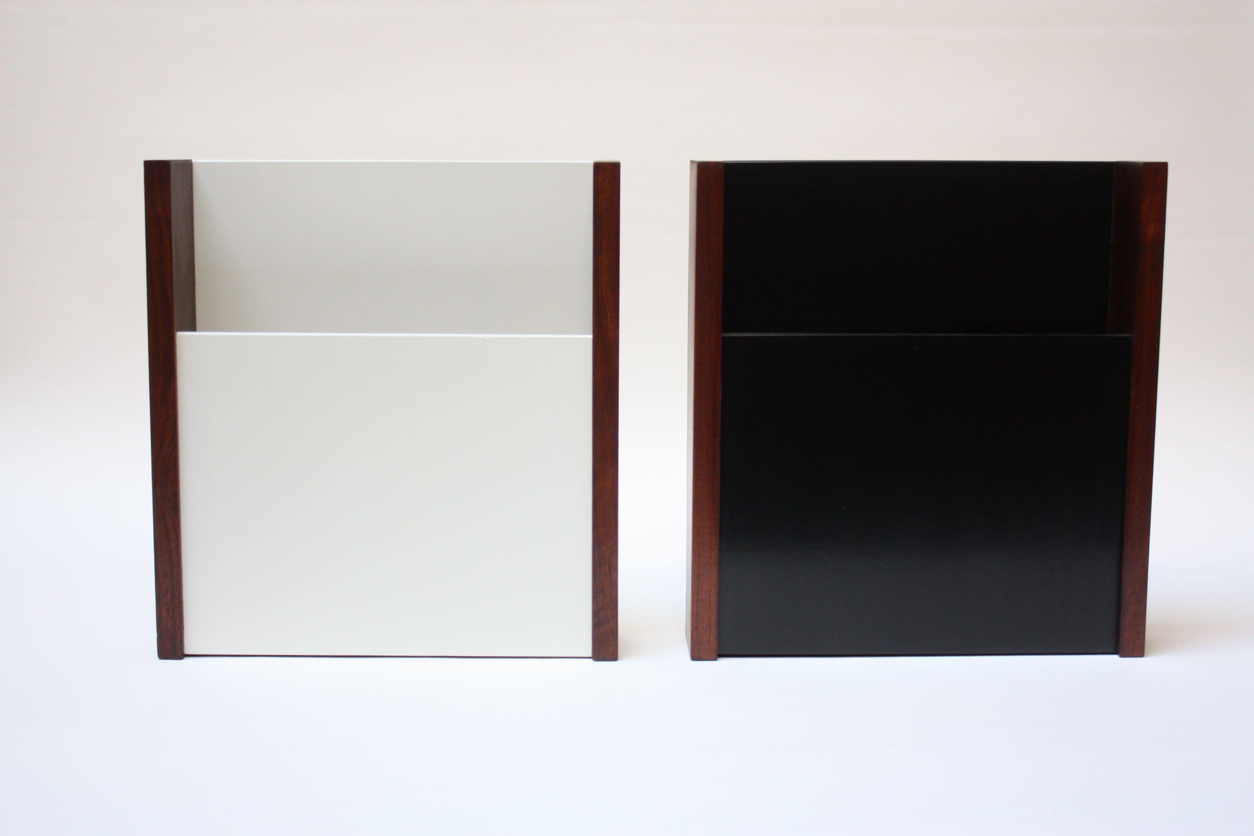 Wall-mounted magazine holders by Peter Pepper Products of Wilmington, CA (circa 1970s). Composed of a laminate divider (one in black, the other in white) framed by walnut borders.
Very nice, vintage condition with minor wear (namely a small edge