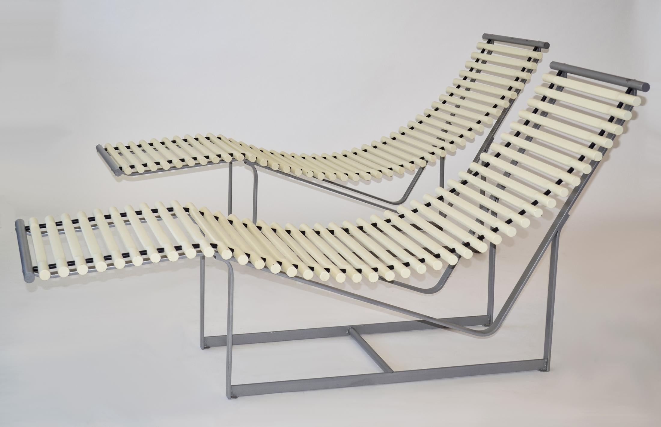 Pair of Peter Strassl Spine Back Lounge Chairs or Chaises Germany 1978

Designed by Peter Strassl in Germany in 1978, this pair of chaise lounge chairs feature a striking sculptural shape - the white, painted solid beech wooden spines give it a