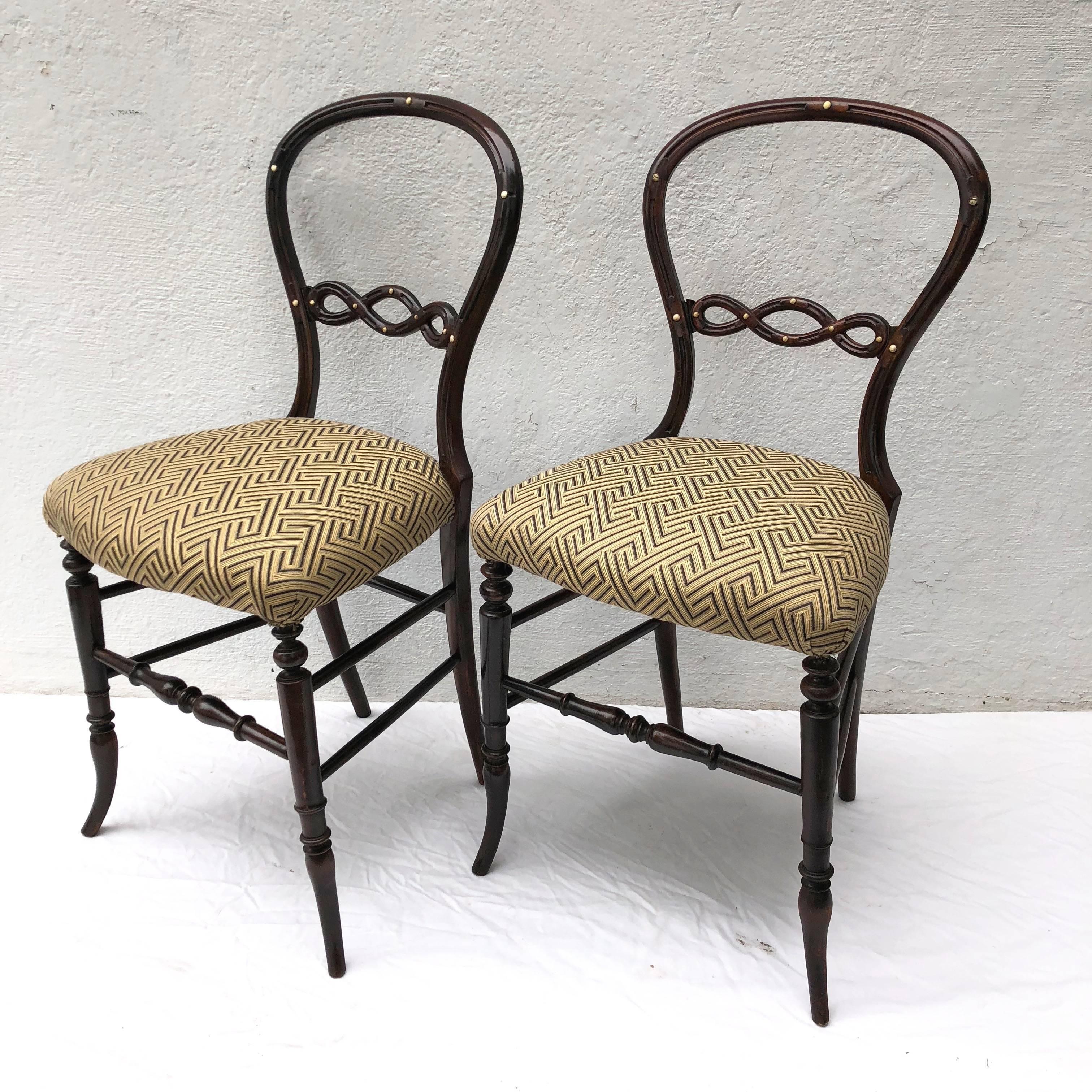 Exquisite pair of English diminutive side chairs having a sensuous circular back with inlaid detail.