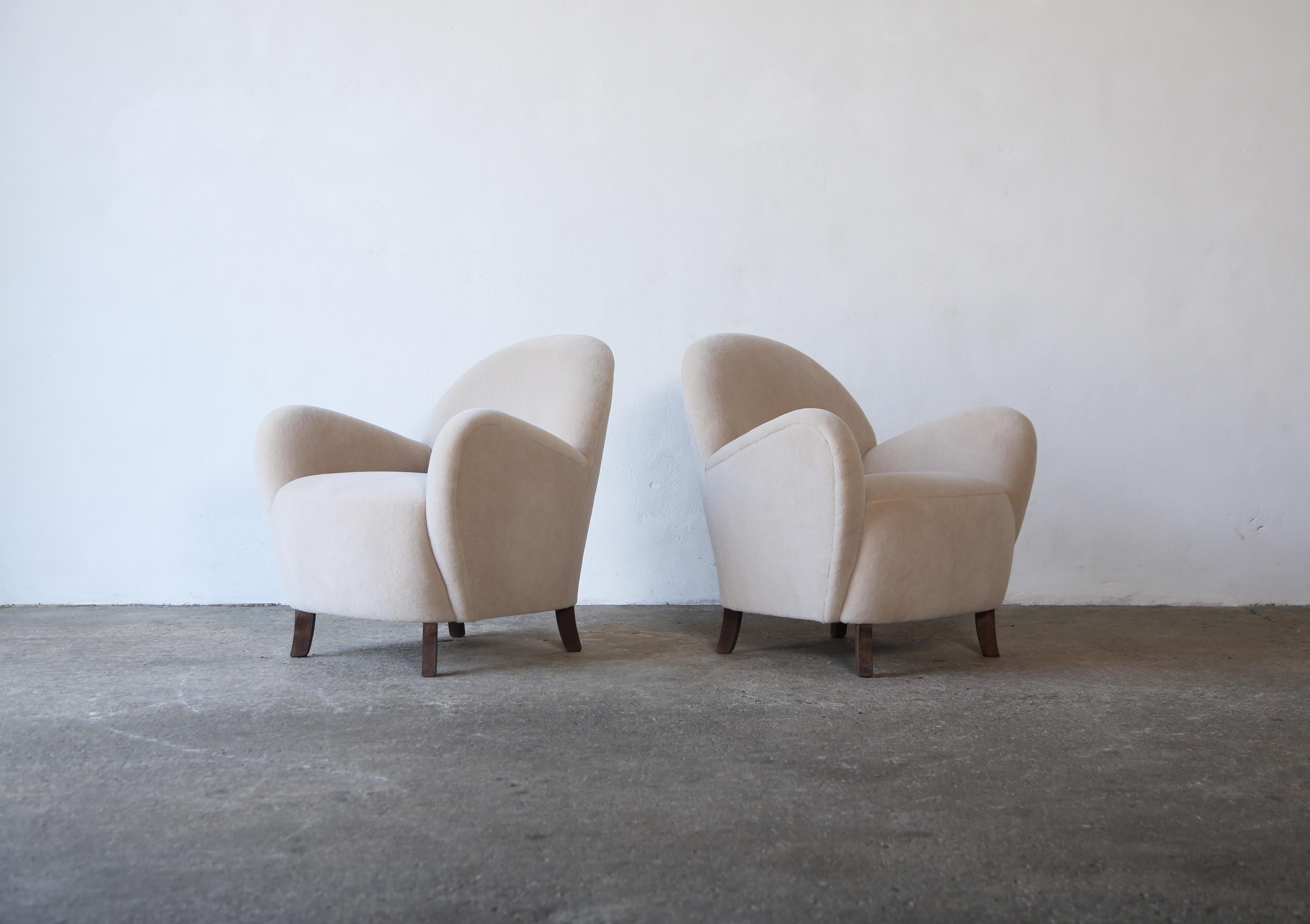 A pair of modern round arm lounge chairs / arm chairs, with beech frames and sprung seats, upholstered in a premium, soft, pure alpaca wool fabric.   Fast shipping worldwide.


