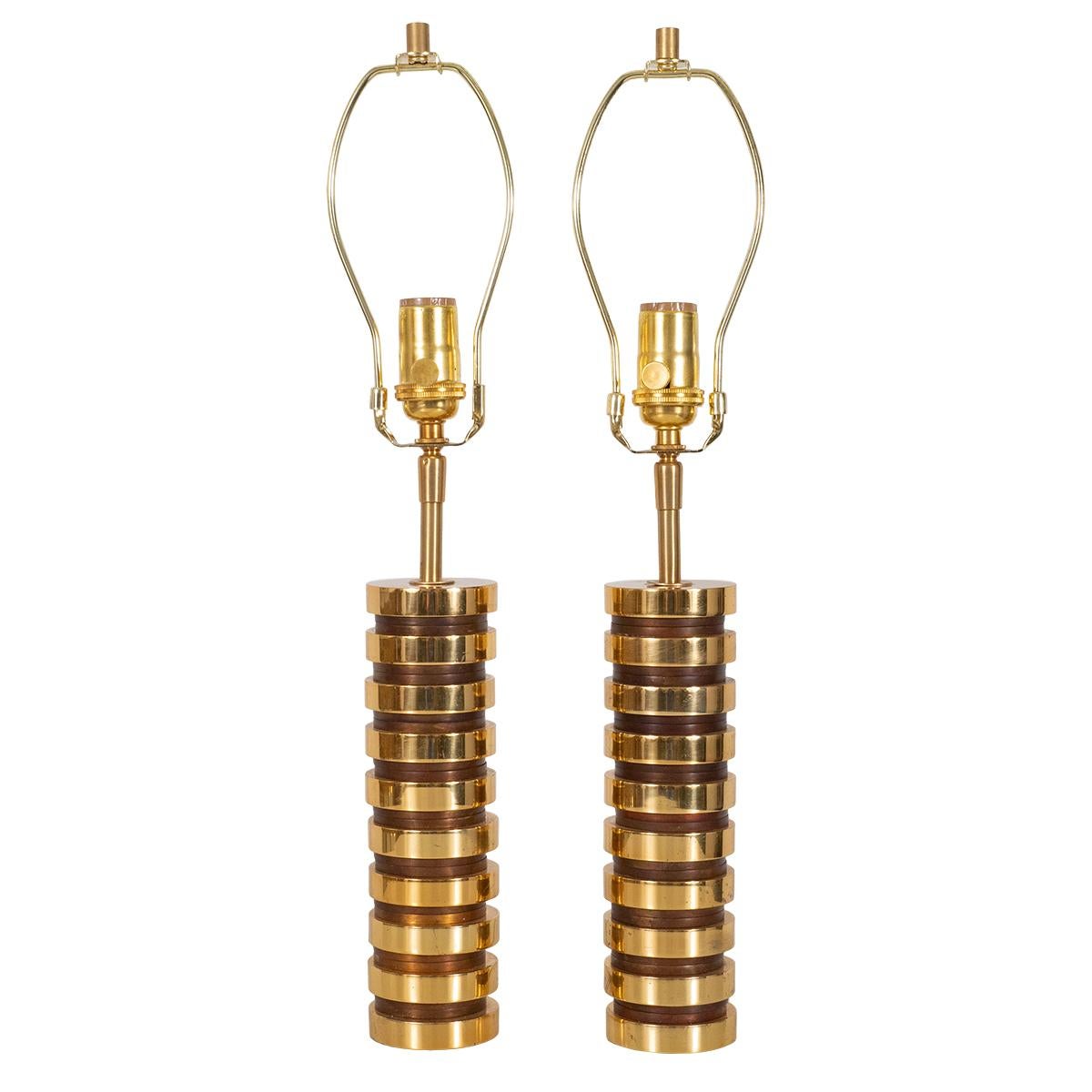Pair of petite cylindrical machined brass table lamps.
