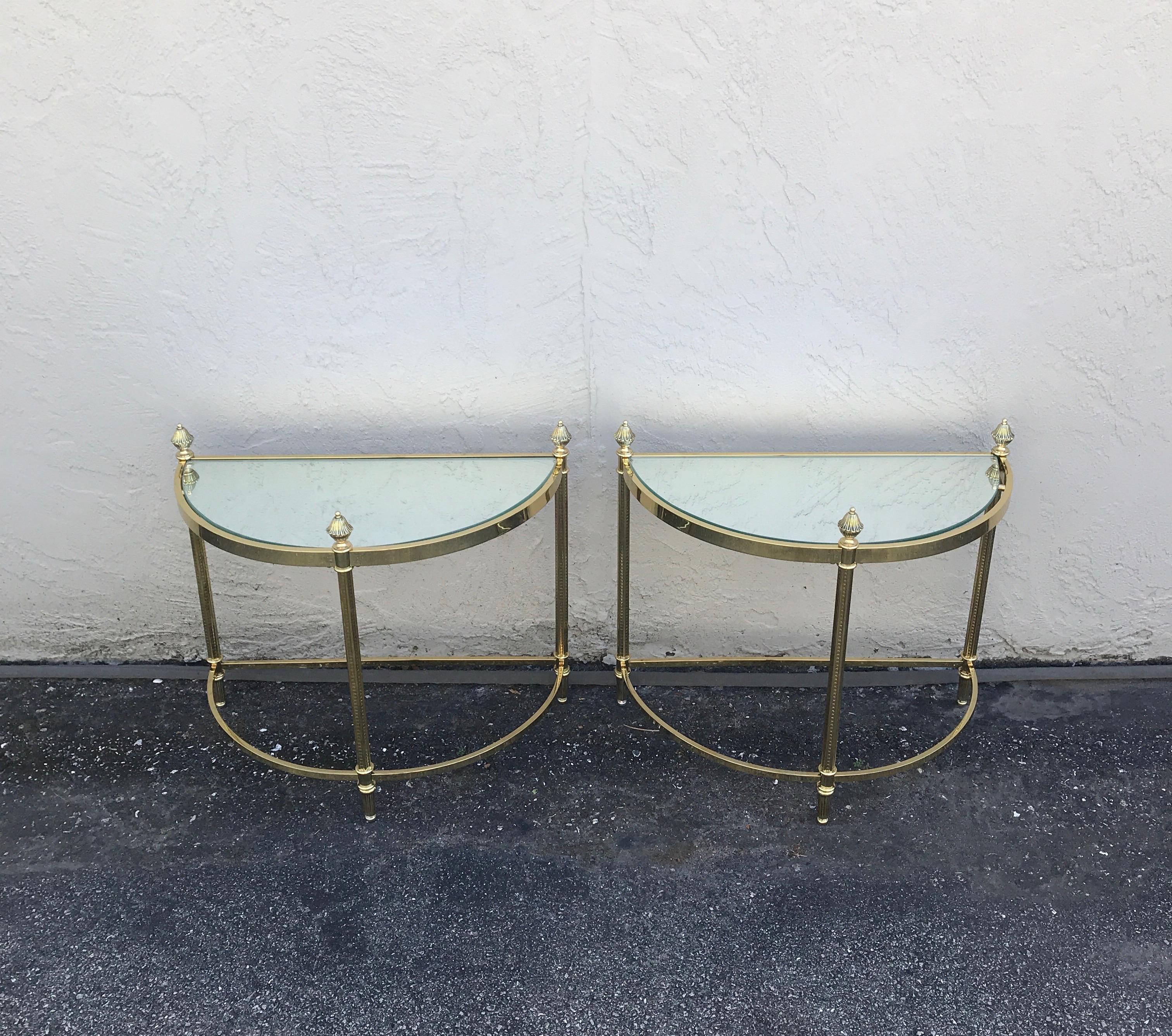 Pair of demi lune brass drinks tables by Maison Jansen.