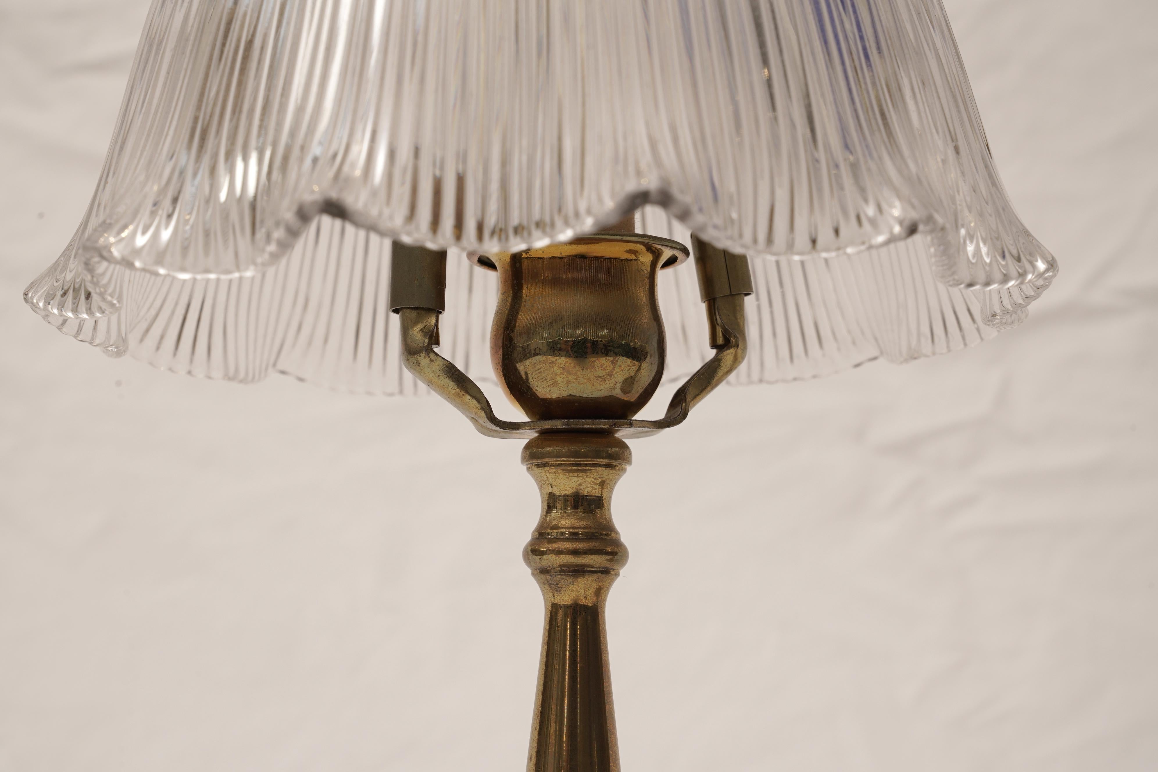 Pair of classic brass petite table lamps with signed, lead-crystal Holophane shades. Takes a candelabra base light and rewired, mid-1900s, American. Shade measures 7 inch diameter x 5 inches high. Base has 4 inch diameter and overall height is 13