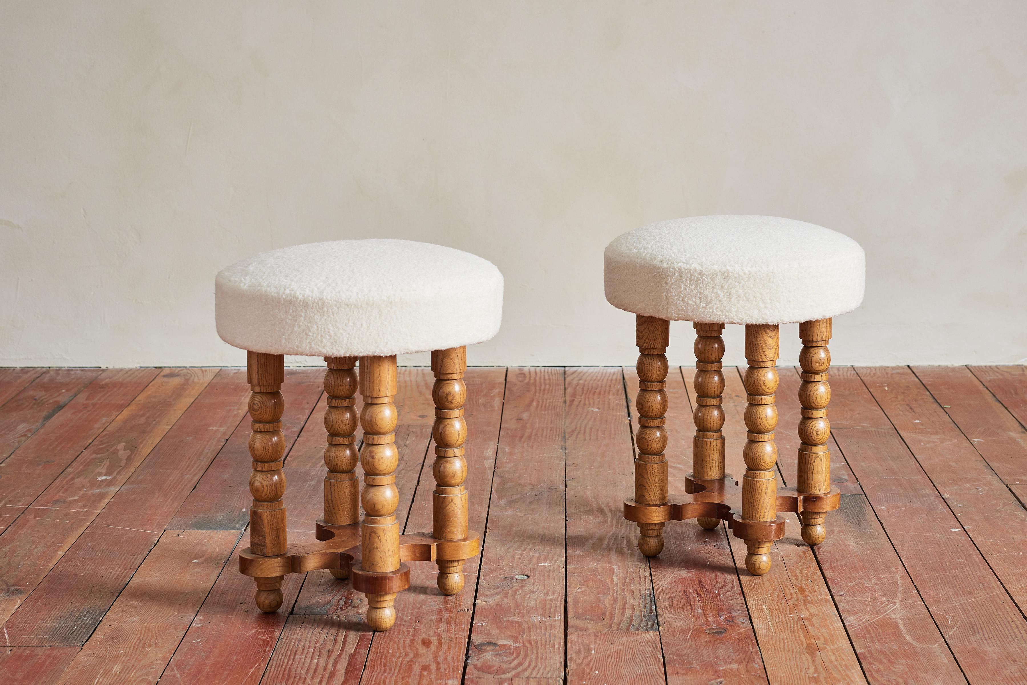 Great pair of stools by Charles Dudouyt with signature carved oak legs 

Newly upholstered in virgin wool 

Wonderful patina throughout.

