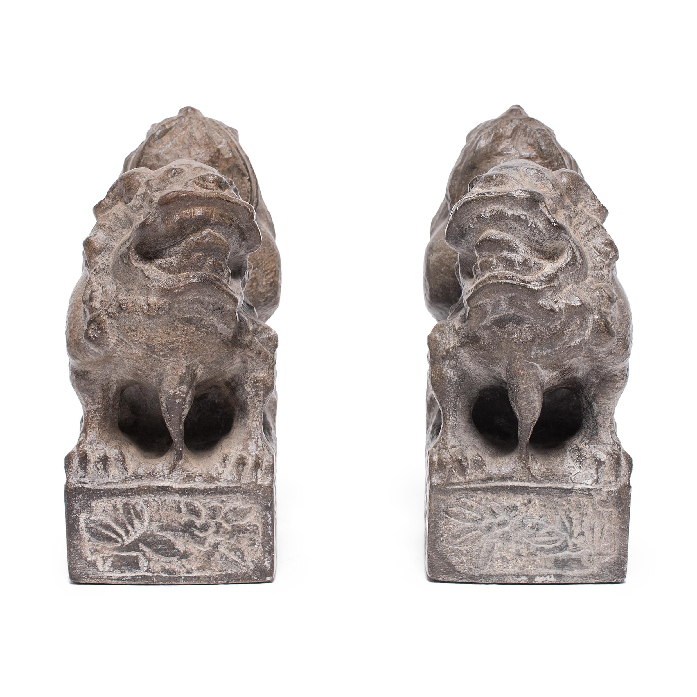 With curly manes, fluffy tails, and playful expressions, these petite stone fu dogs are adorable companions and benevolent guardians of the home. Also known as shizi, the pair represents yin and yang, the dual forces of the universe. Standing in