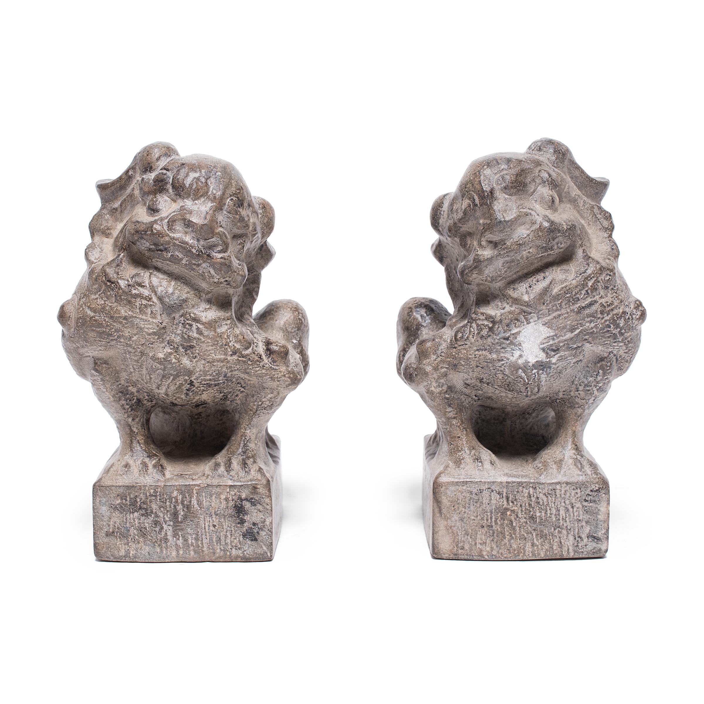 With curly manes, fluffy tails, and playful expressions, these petite stone fu dogs are adorable companions and benevolent guardians of the home. Also known as shizi, the pair represents yin and yang, the dual forces of the universe. Standing in