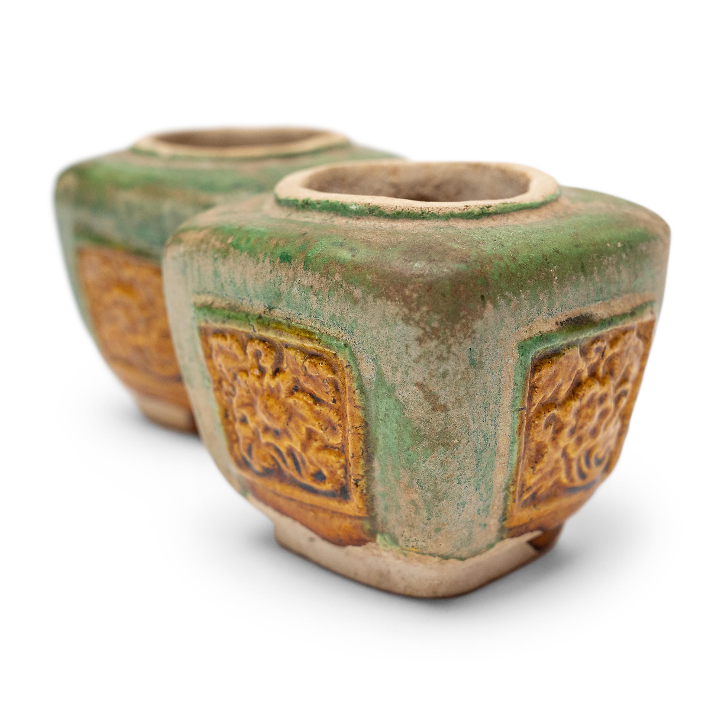 With sancai glaze and a richly-aged patina, these petite ceramic spice jars are likely originated as a form of míngqì sculpture, a centuries-old tradition of burial figurines or 
