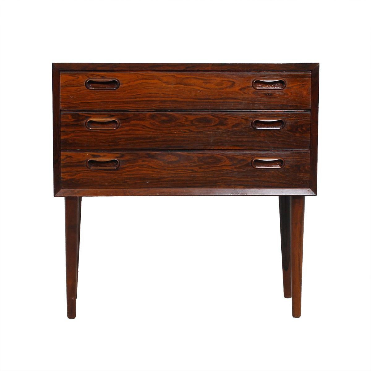 Pair of Petite Danish Rosewood 3 Drawer Nightstands / End-Tables

Additional information:
Material: Rosewood
The Minimalist Danish Modern design of this chest of drawers allows the luxurious rosewood to take center stage. The case, with three