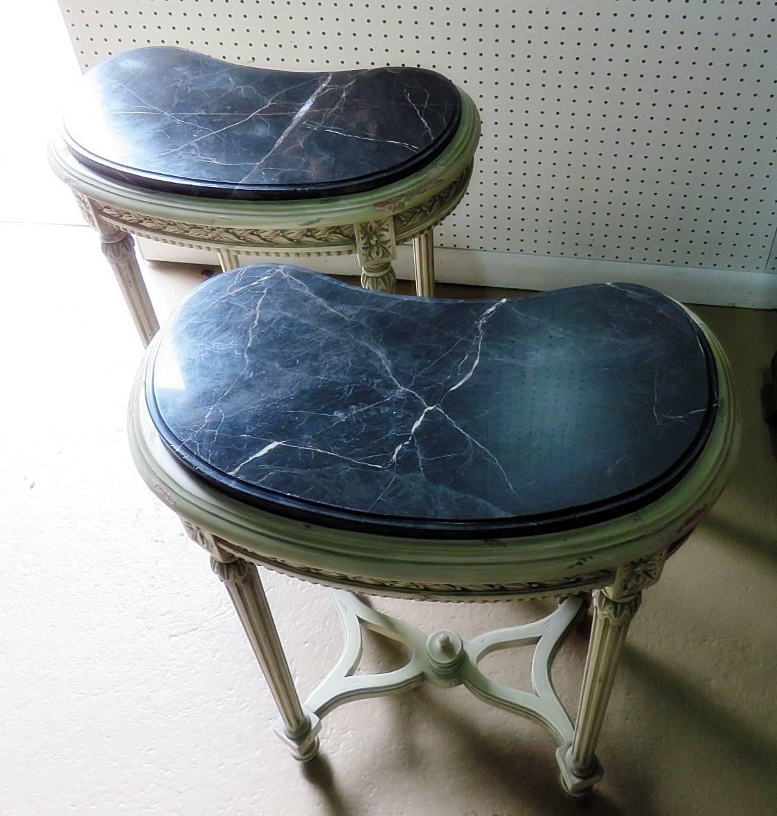 Pair of petite Louis XVI style demilune distressed painted marble-top consoles.