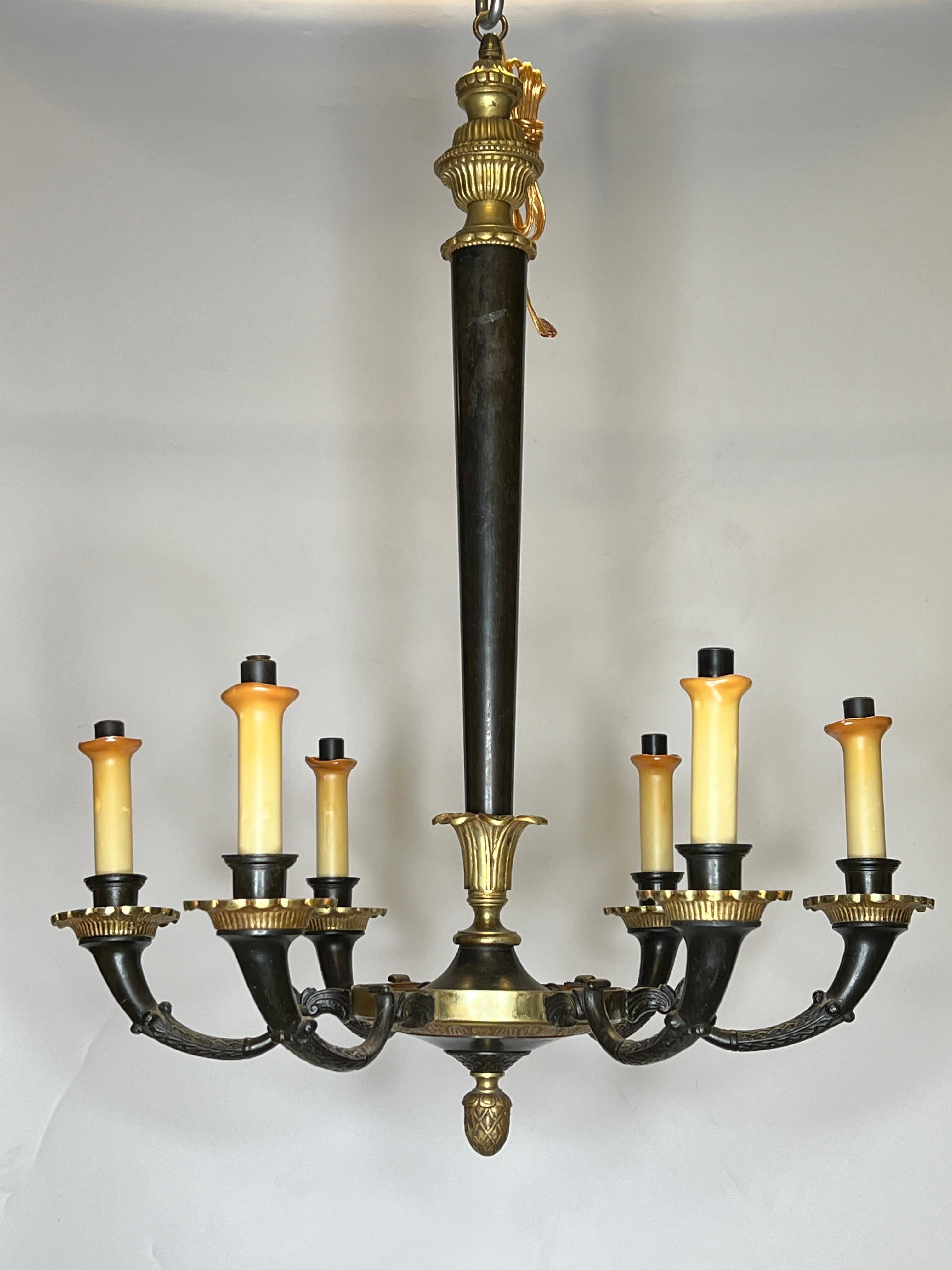 Pair of French mid century Petite Empire Style Patinated and Gilt Bronze Chandeliers