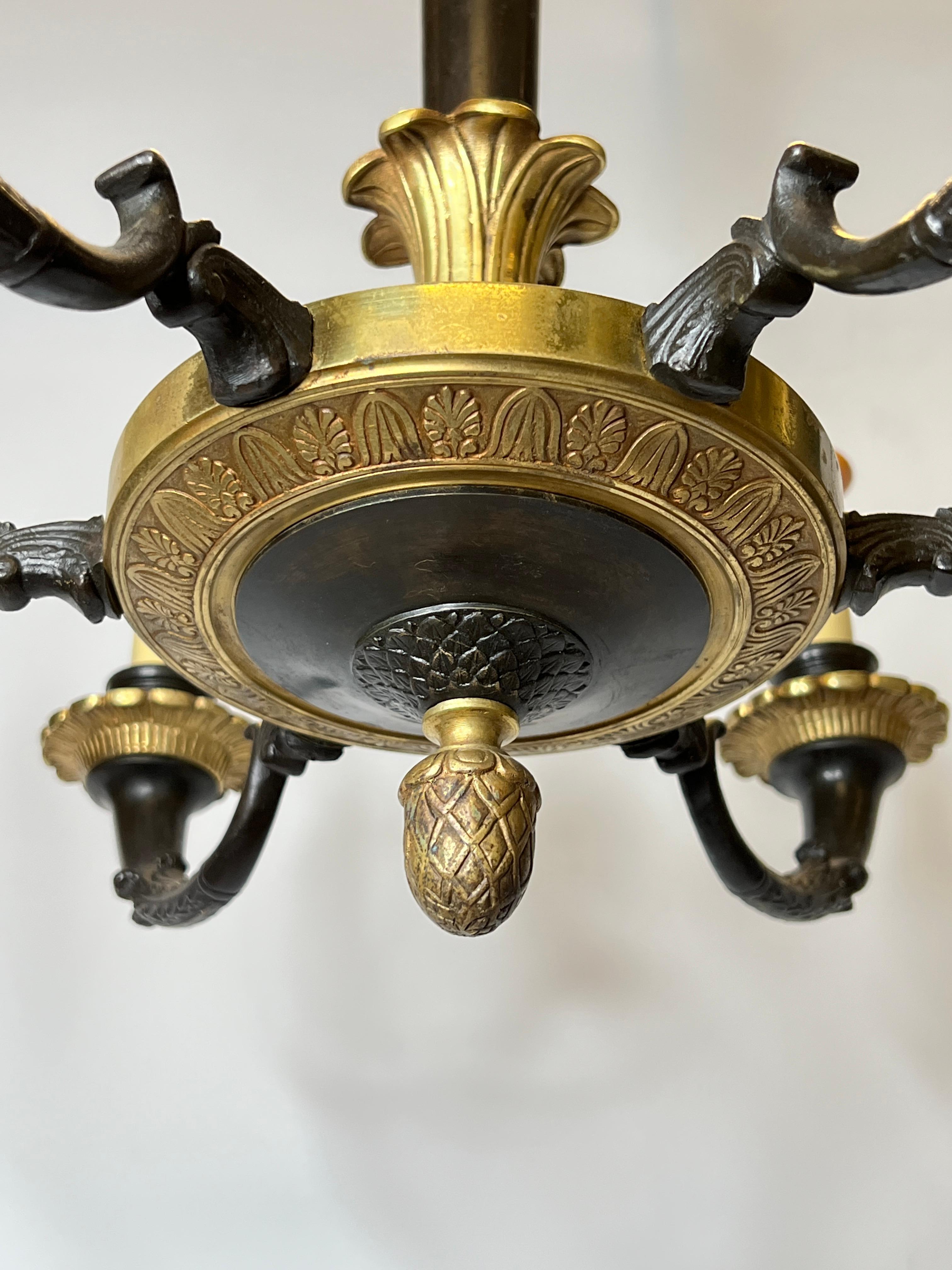 Pair of Petite Empire Style Patinated and Gilt Bronze Chandeliers In Good Condition For Sale In New York, NY
