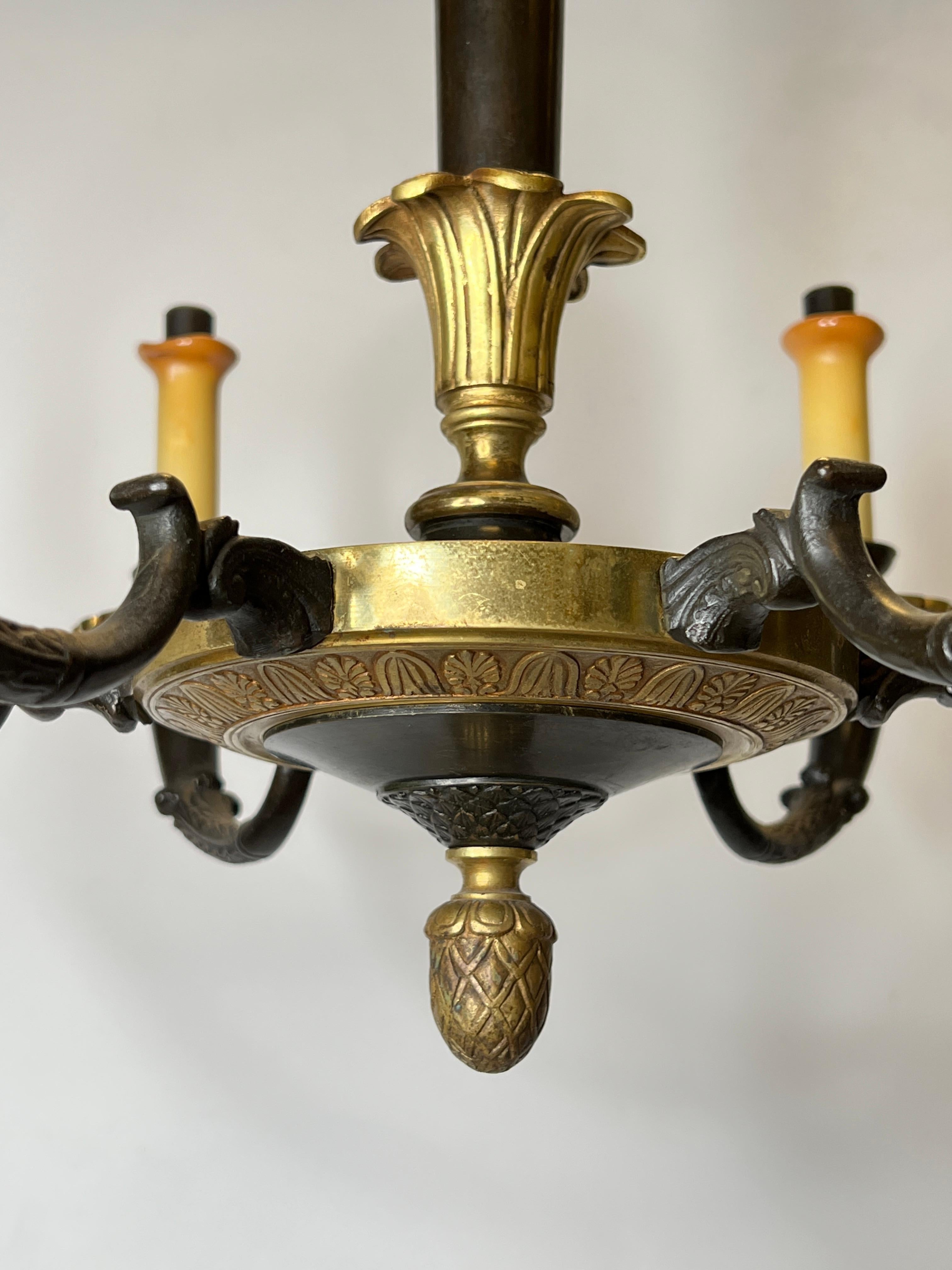 20th Century Pair of Petite Empire Style Patinated and Gilt Bronze Chandeliers For Sale