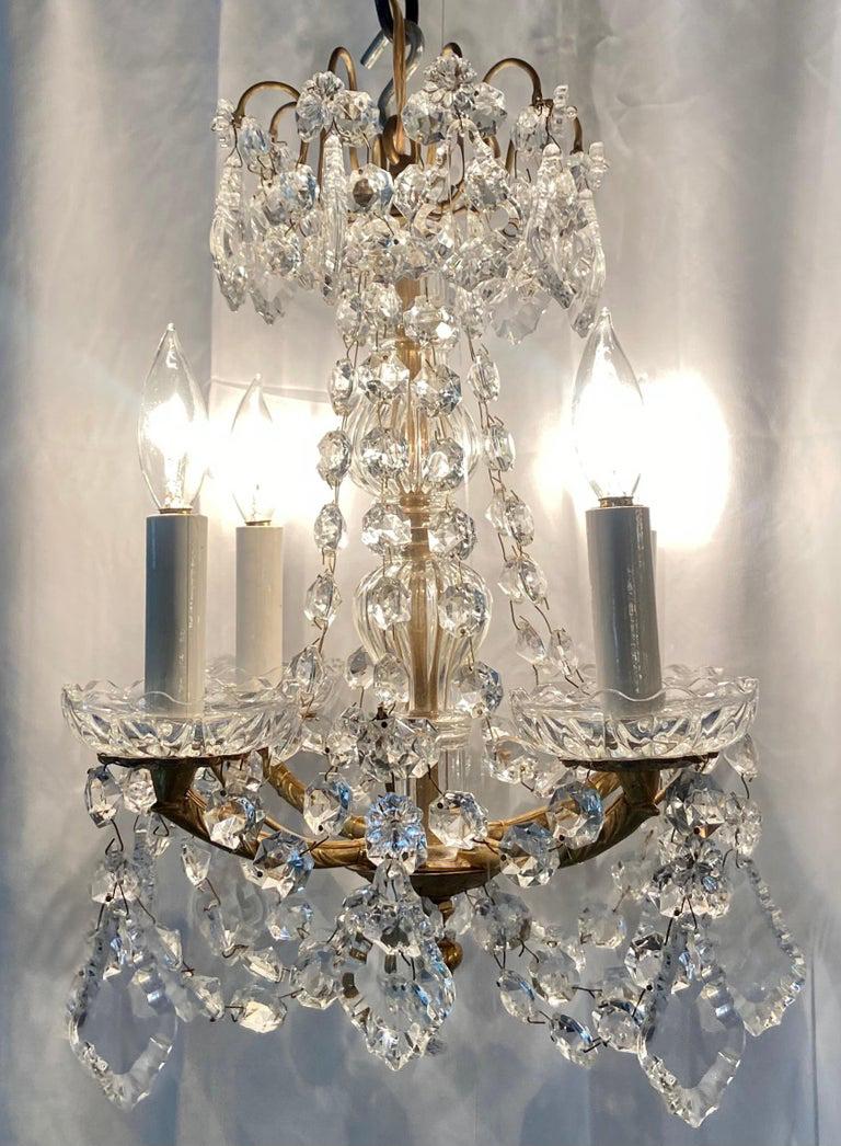 Pair of Petite Estate crystal and gold bronze chandeliers, Circa 1930-1940.