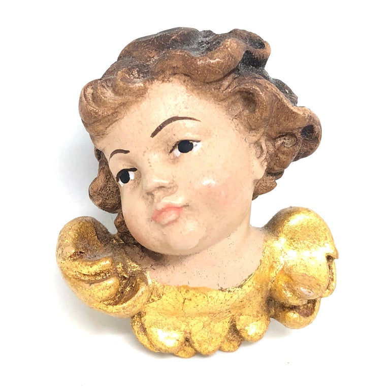 Pair of beautiful small miniature hand carved cherub angel Heads, found at an estate sale in Germany. Made by a woodcarver in the Oberammergau area in Germany, this area is well-known for their wood carvings. We believe that this pieces are for the