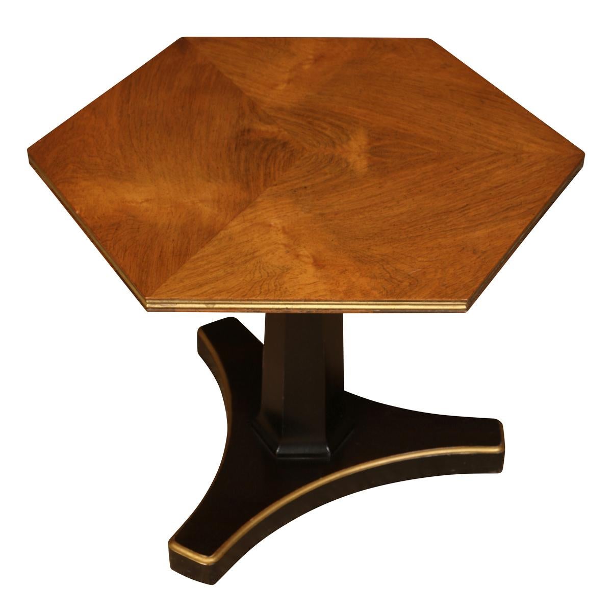 A pair of petite hexagonal Regency style side tables with ebonized pedestal bases and walnut tops in hexagonal motif.