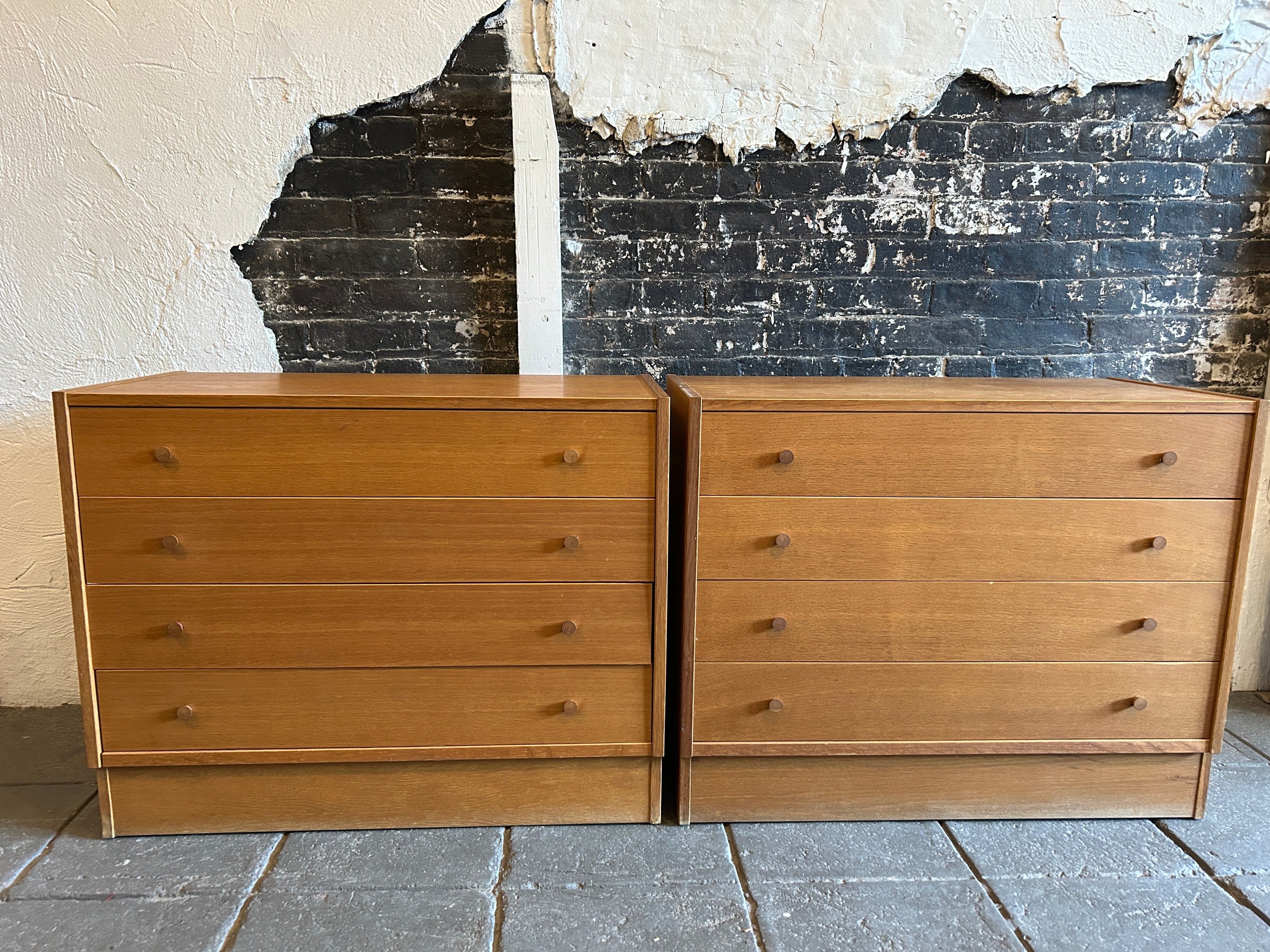 Pair of Mid-Century Modern danish 4 drawer dressers in light teak laminate with tapered teak pulls. Clean inside and out all drawers slide smooth. Get pair of small dressers. Located in Brooklyn NYC

Sold as a set of (2) 1 pair 

Measurements