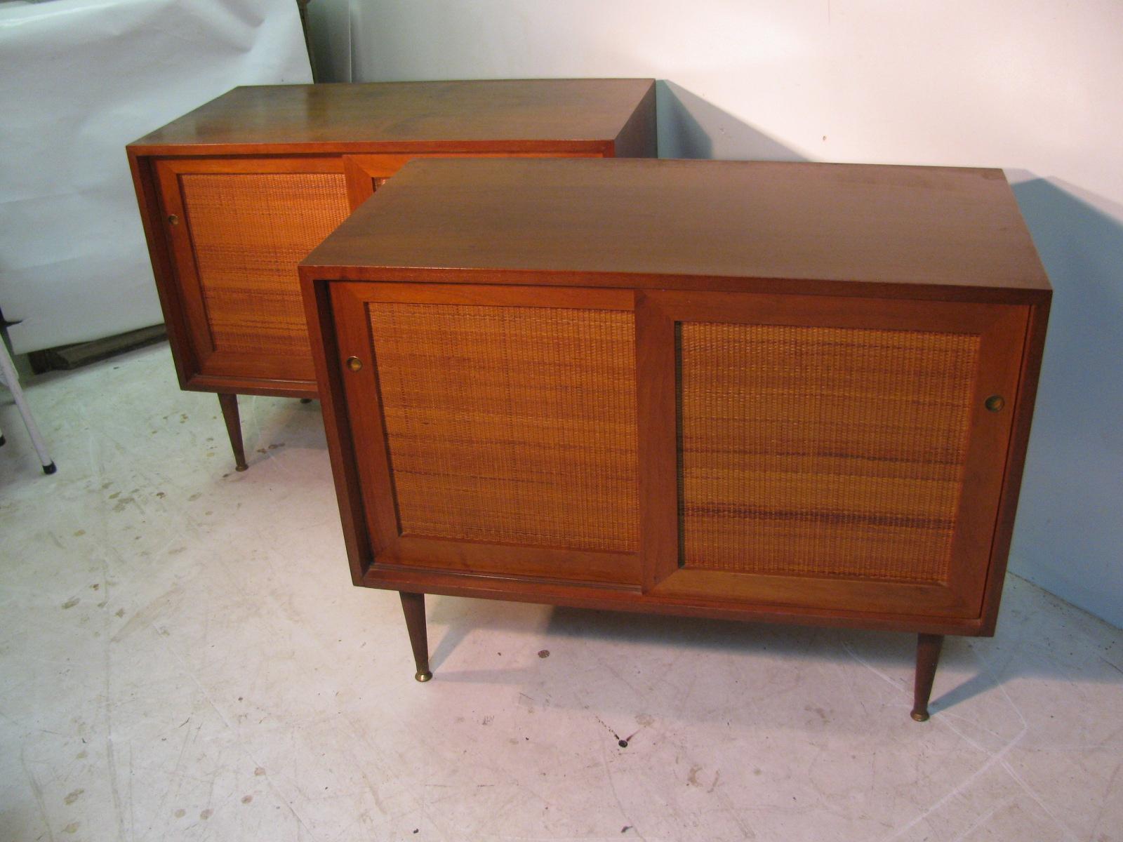 Fabulous matching pair of walnut Credenzas which are small enough to work in several areas. Possibly separated and used in the bedroom or put together to use in the dining area. Each cabinet has two sliding doors and a shelf inside. Would work very