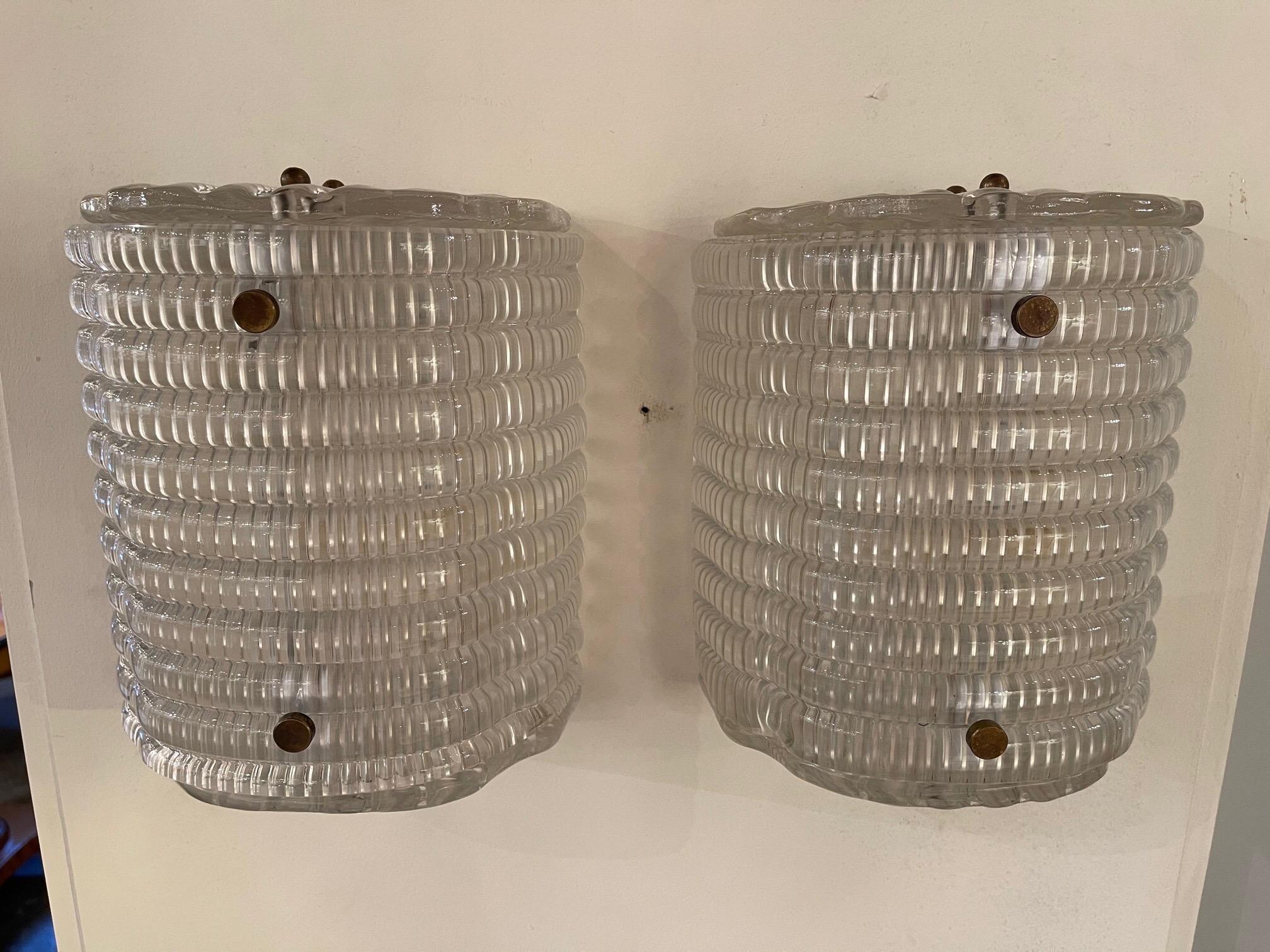 Handsome pair of petite Murano wave glass barrel form sconces. These would be an excellent choice for a powder room or a small space. So pretty!!