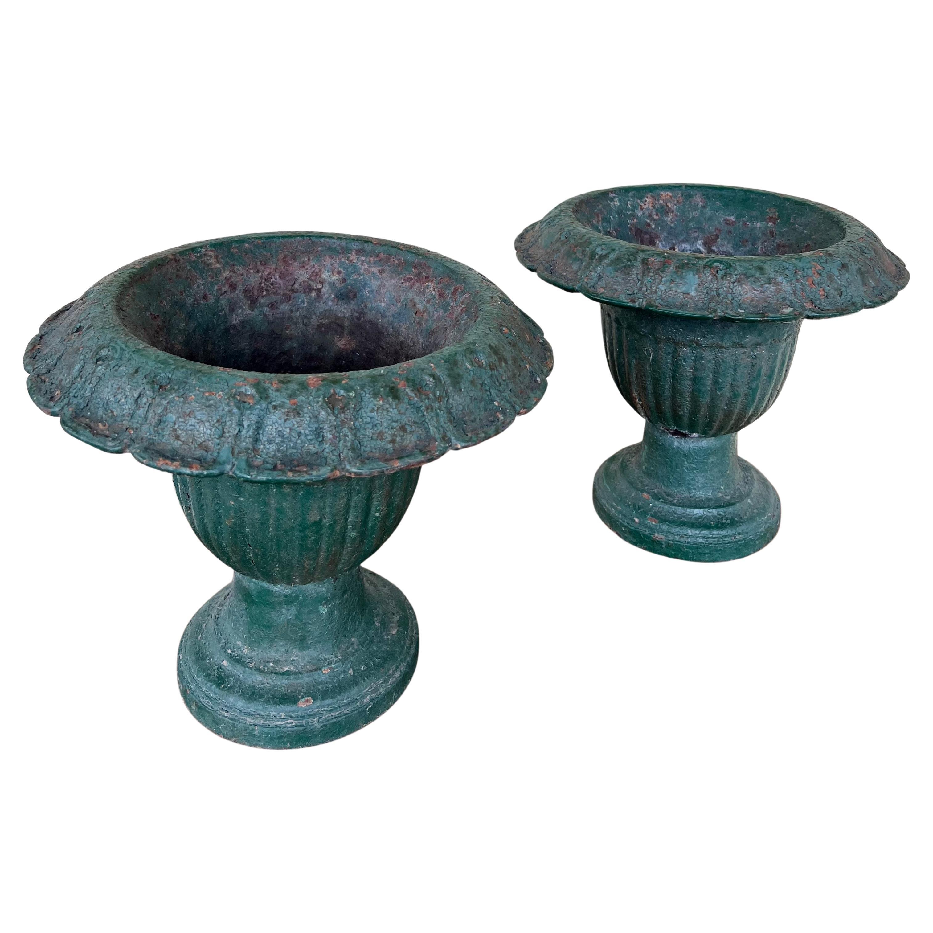 Pair of Petite Painted Cast Iron Urns