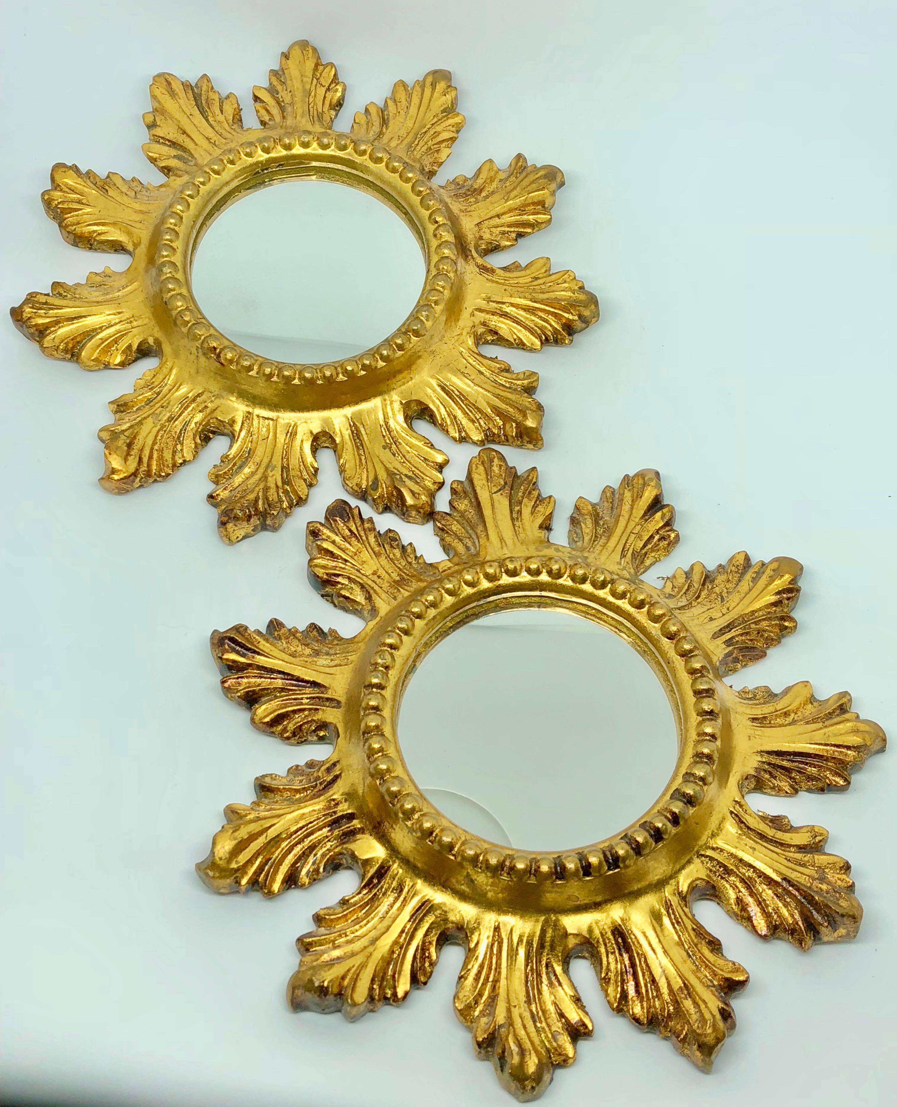 Pair of gorgeous starburst mirrors. Made of gilded wood and composition. No chips, no cracks, no repairs. Each measures approximate 9 1/8