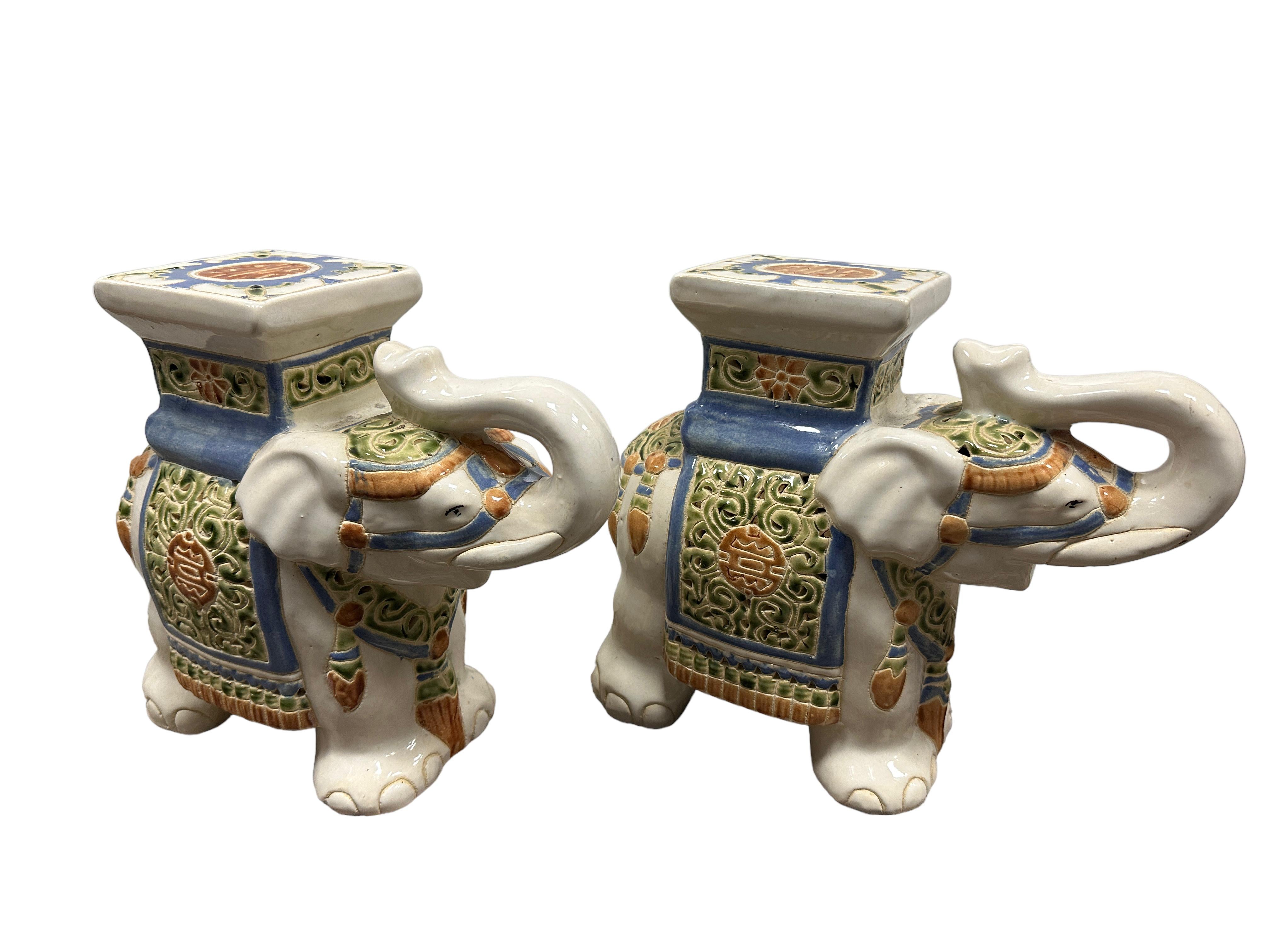 A pair of petite mid-20th century glazed ceramic elephant flower pot seats. Handmade of ceramic. Nice addition to your home, patio or garden. Found at an Estate Sale in Nuremberg, Germany. 
     