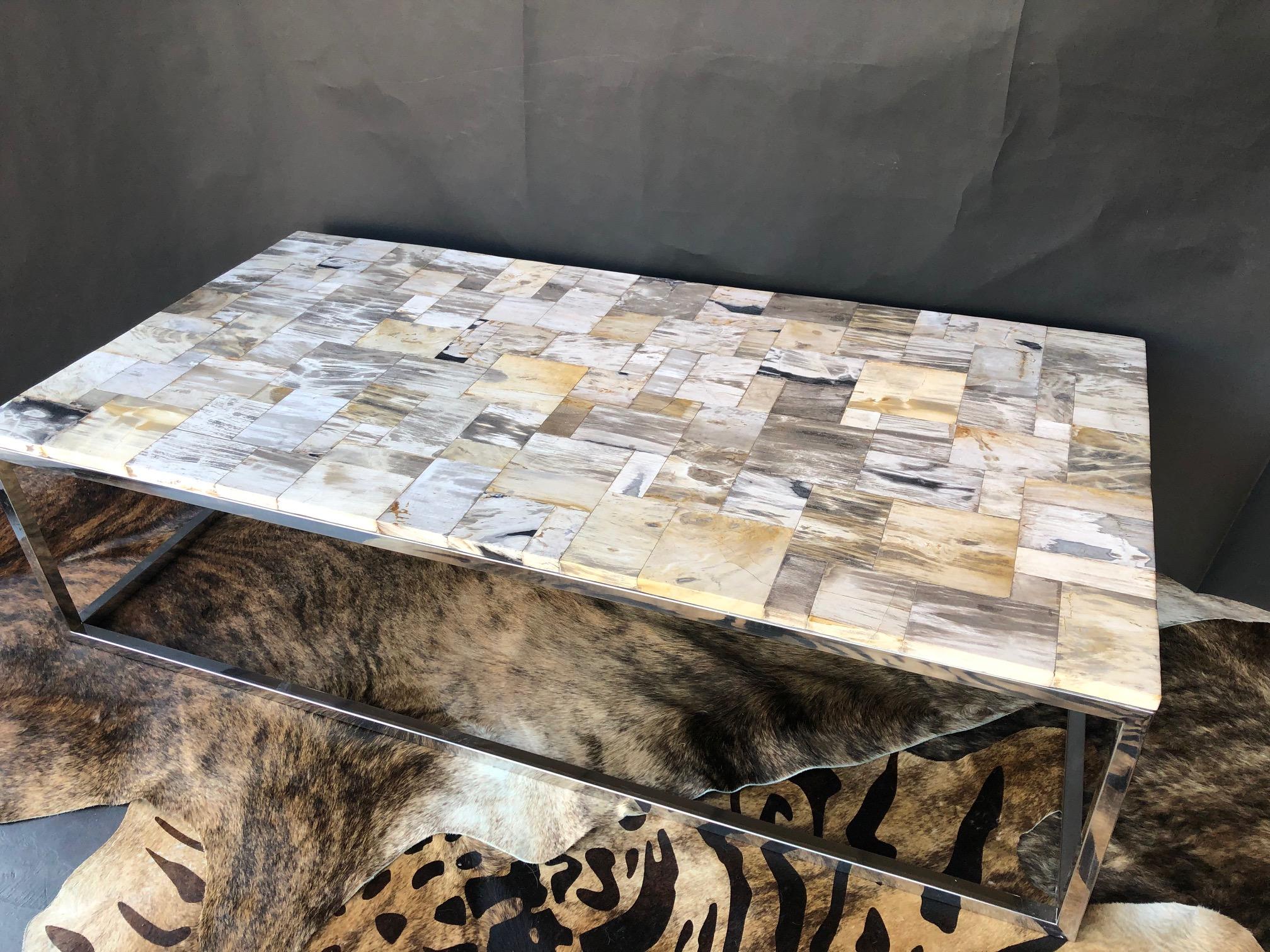 Petrified wood tiled top coffee table. Base is bronze nickel-plated.

