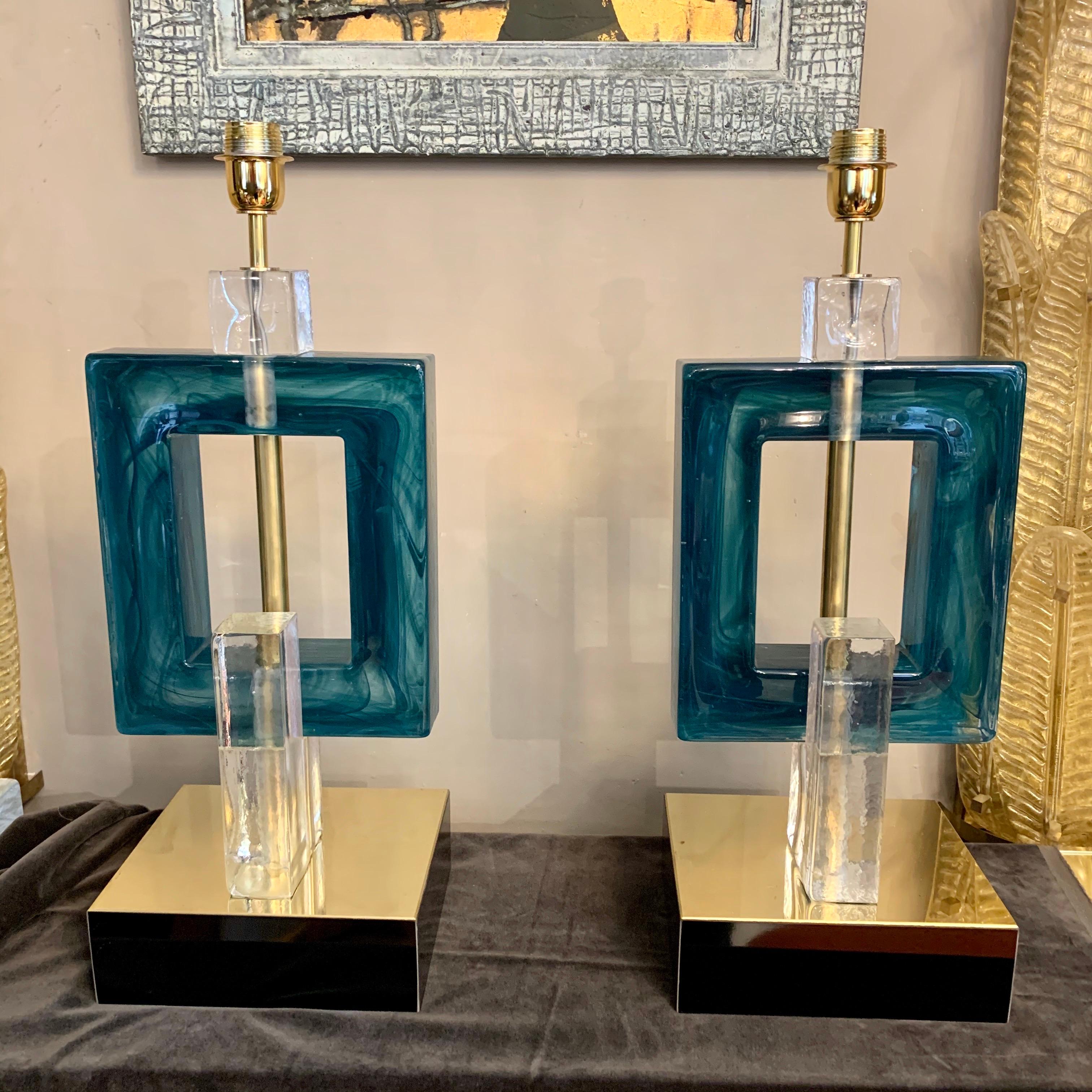 Pair of petrol green Murano table lamps, green melange handmade full and heavy glass blocks, black lacquered wood base with brass top. Customized designs lampshades are handcrafted in our shop by us on request.